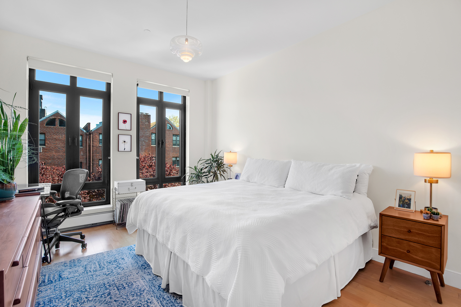 309 2nd Street, Unit 3E Brooklyn, NY 11215 - Photo 7 of 11 a bedroom with a bed and a lamp on table