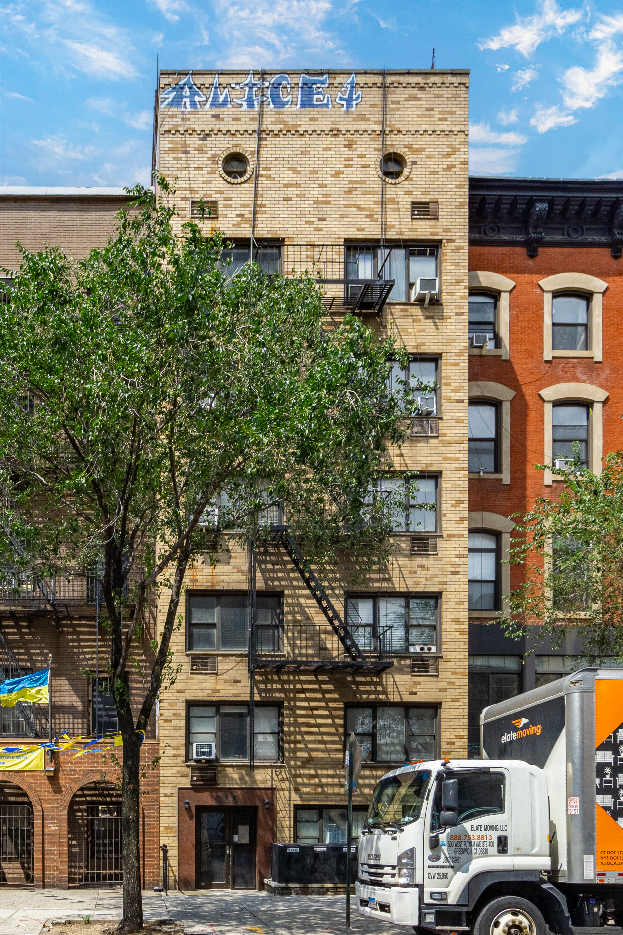 205 2nd Avenue, Unit 4A Manhattan, NY 10003 - Photo 7 of 13 a front view of a building with parking area