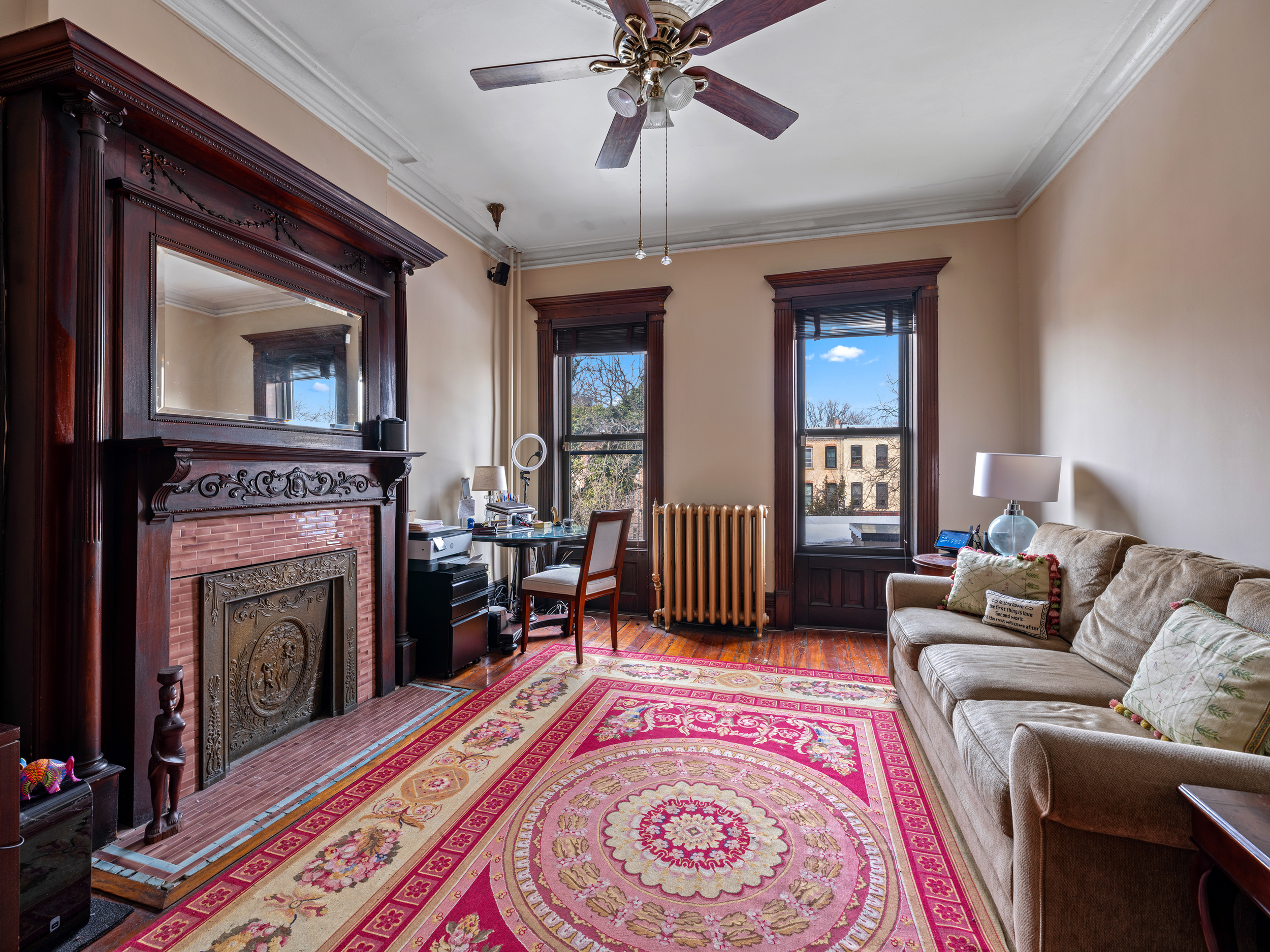 291 Sterling Place Brooklyn, NY 11238 - Photo 7 of 19 a living room with a couch and a fireplace