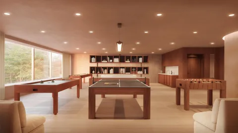 a living room with stainless steel appliances dining table furniture and a large window