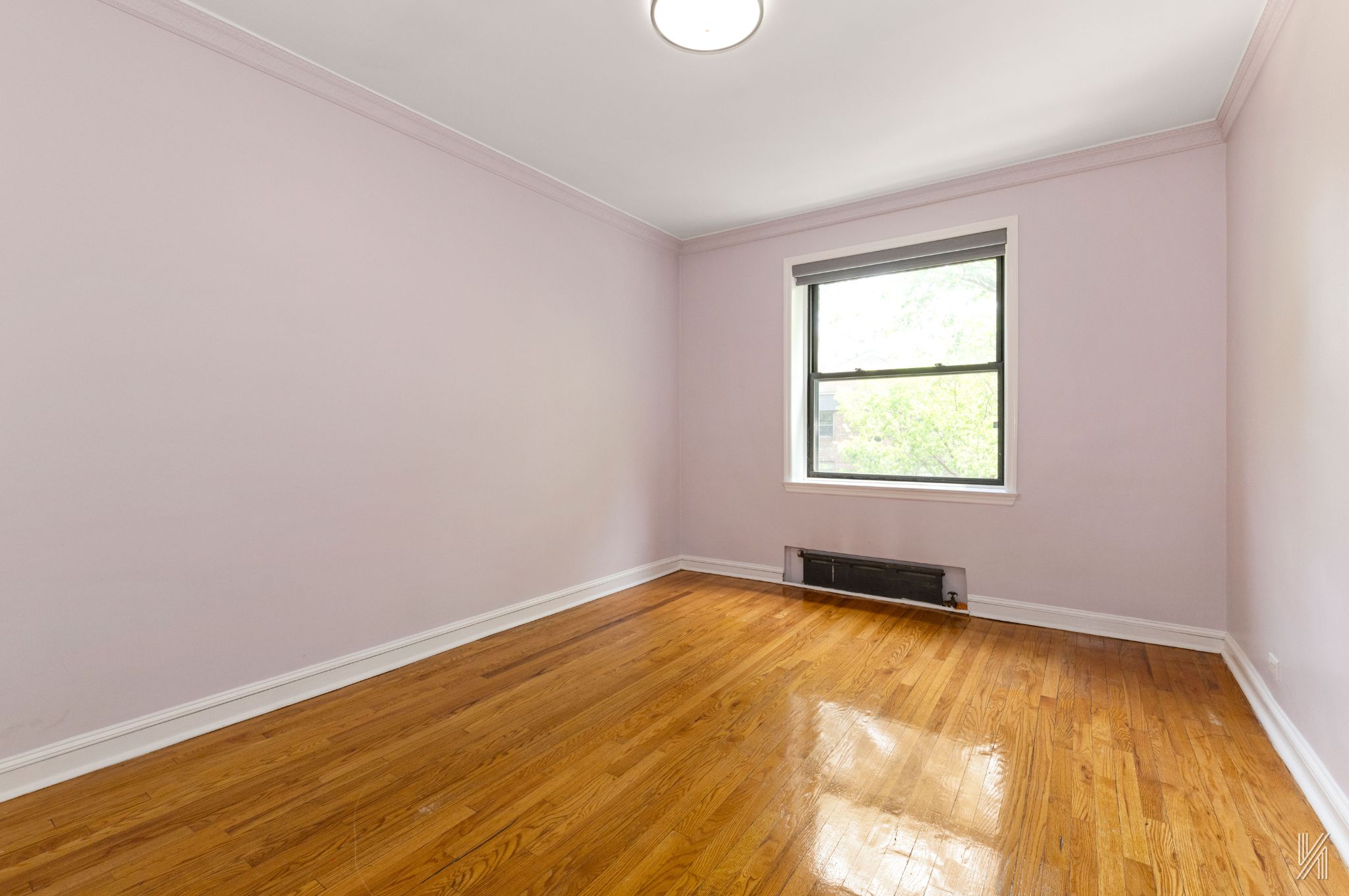22-20 76th Street, Unit C3 Queens, NY 11370 - Photo 13 of 20 an empty room with a window