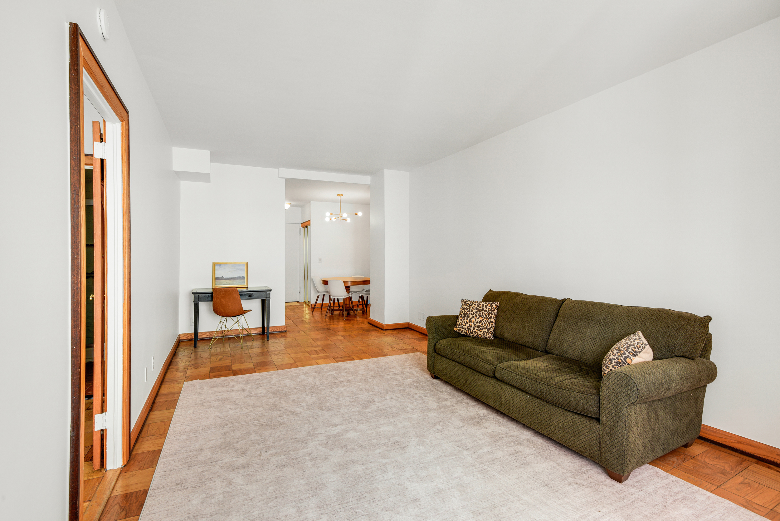 520 East 72nd Street, Unit 10P Manhattan, NY 10021 - Photo 6 of 13 a living room with furniture and a table