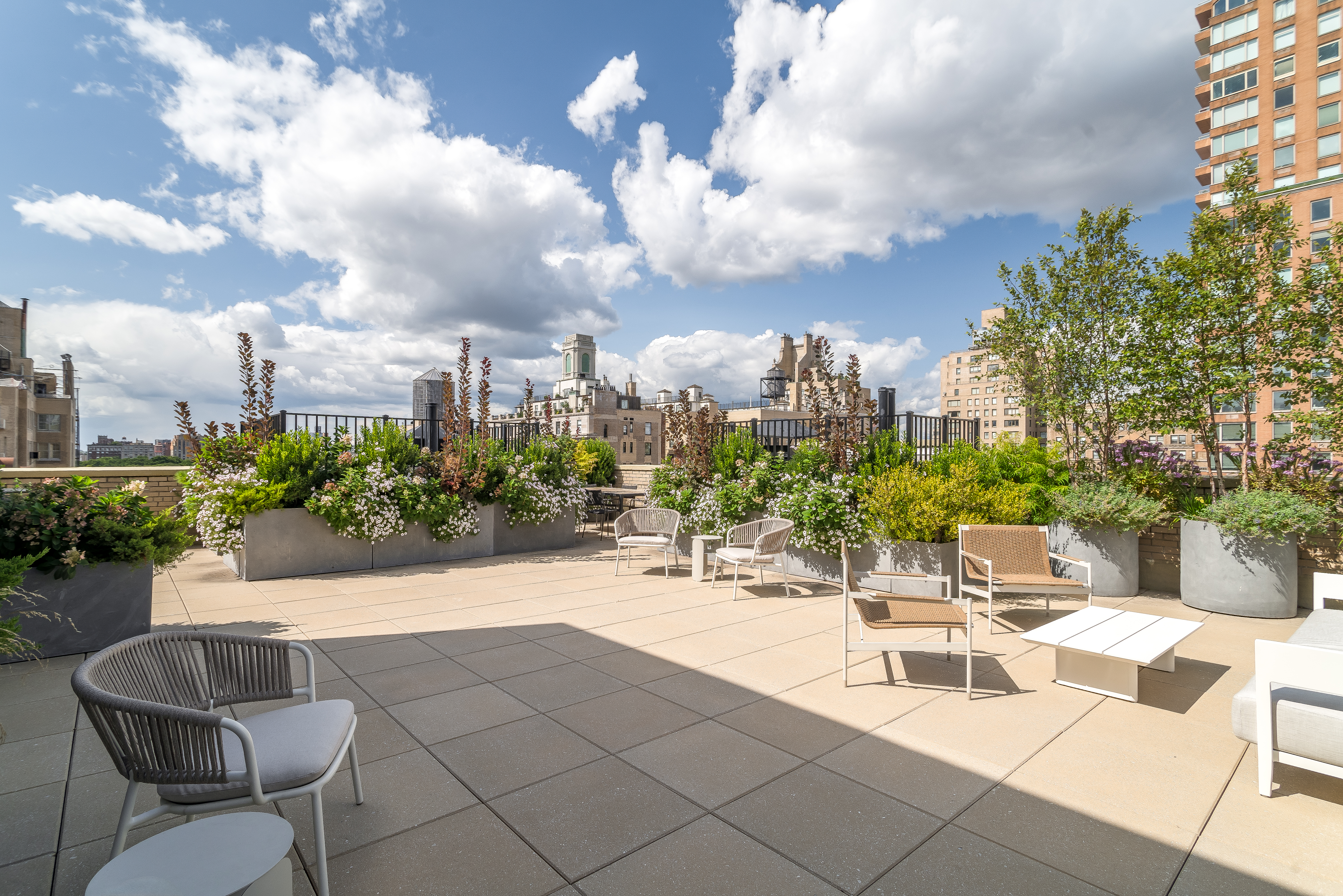 25 East 83rd Street, Unit 10D Manhattan, NY 10028 - Photo 11 of 17 a view of a terrace with furniture and a garden