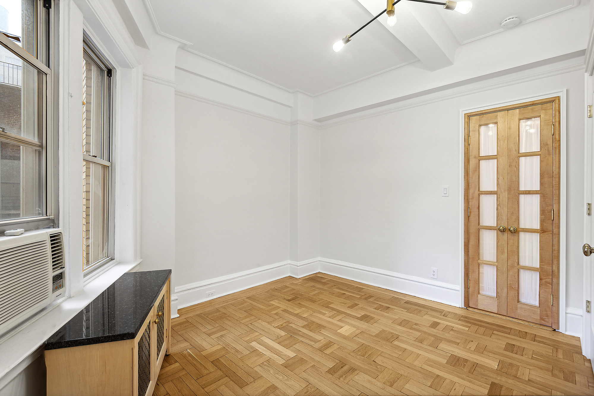 145 West 86th Street, Unit 12B Manhattan, NY 10024 - Photo 6 of 12 a bedroom with a bed and a window with outer view