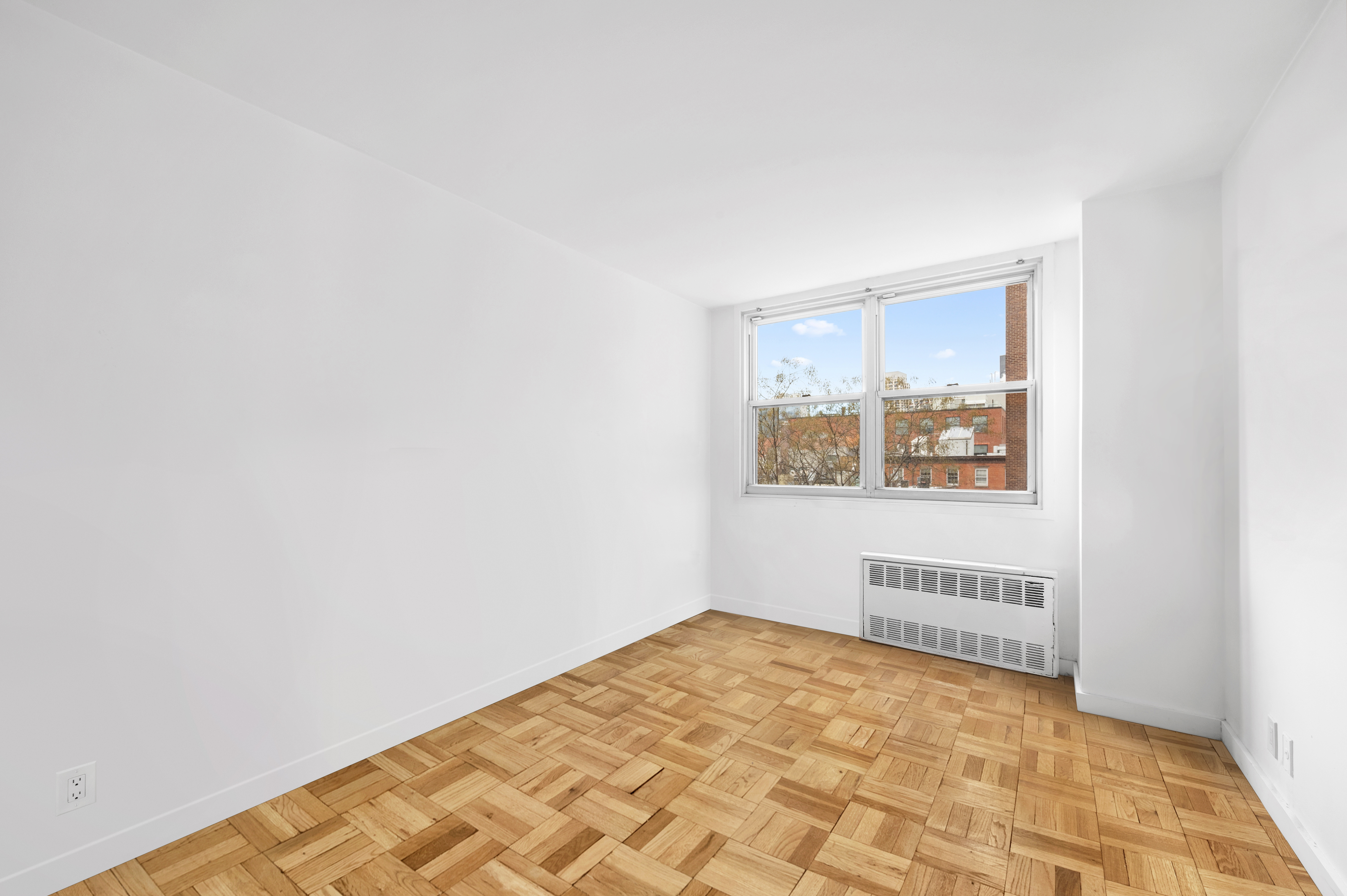 61 Jane Street, Unit 5A Manhattan, NY 10014 - Photo 7 of 13 a view of an empty room