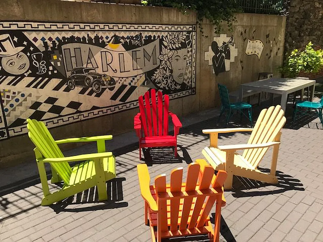 48 West 138th Street, Unit 5J Manhattan, NY 10037 - Photo 7 of 13 a view of chairs and tables in wooden floor