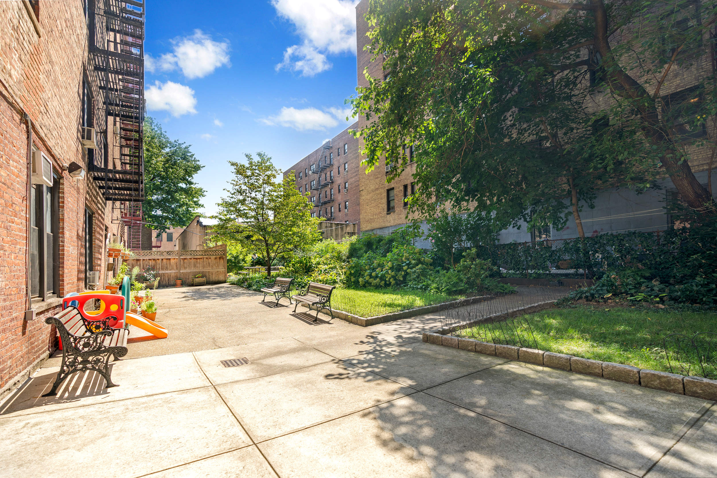 736 West 186th Street, Unit 5B Manhattan, NY 10033 - Photo 10 of 16 a view of a chair and table in the backyard of the house