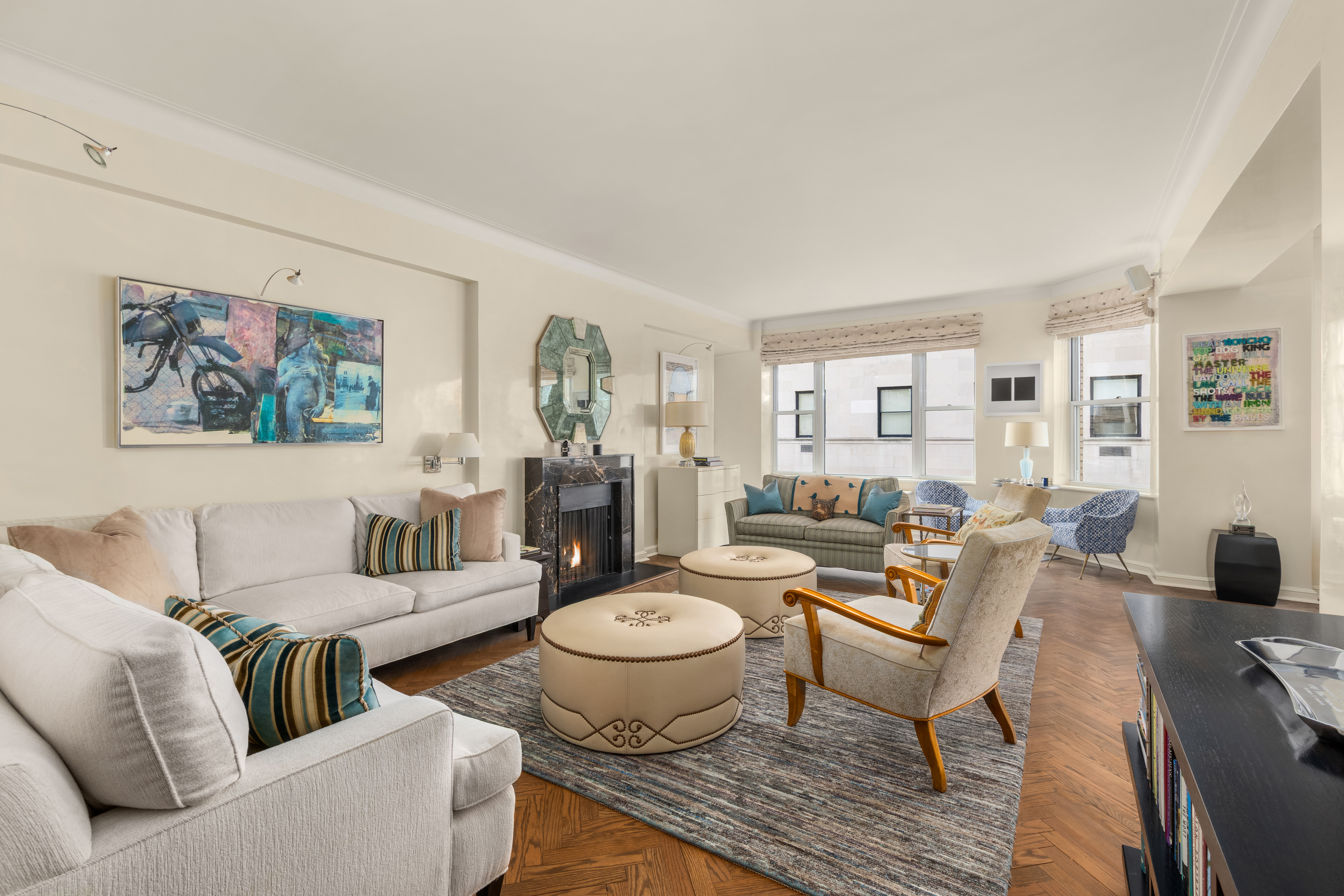 1 East 66th Street, Unit 9EF Manhattan, NY 10065 - Photo 4 of 19 a living room with furniture and a wooden floor
