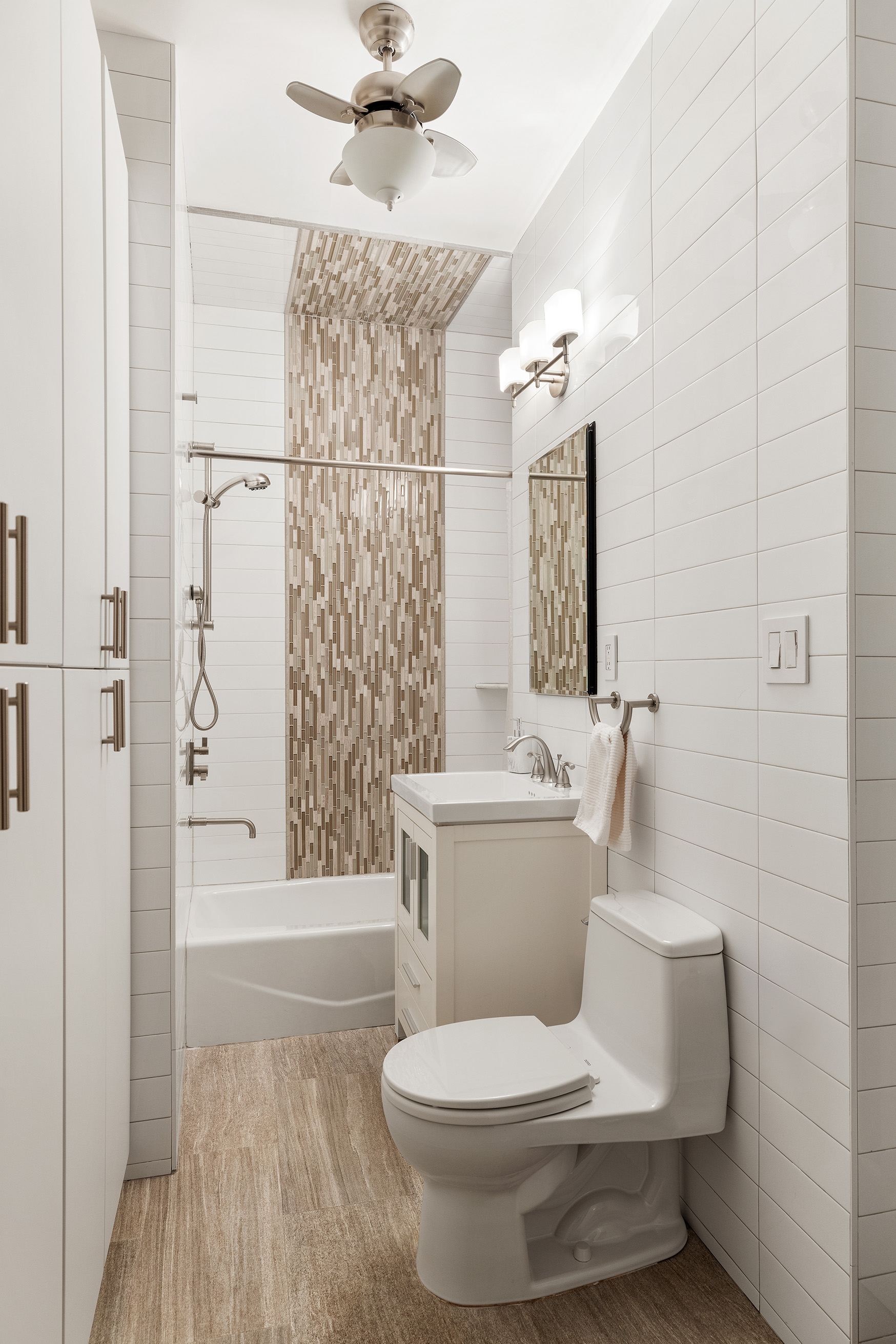 137 Riverside Drive, Unit 2D Manhattan, NY 10024 - Photo 7 of 20 a bathroom with a toilet a sink and shower