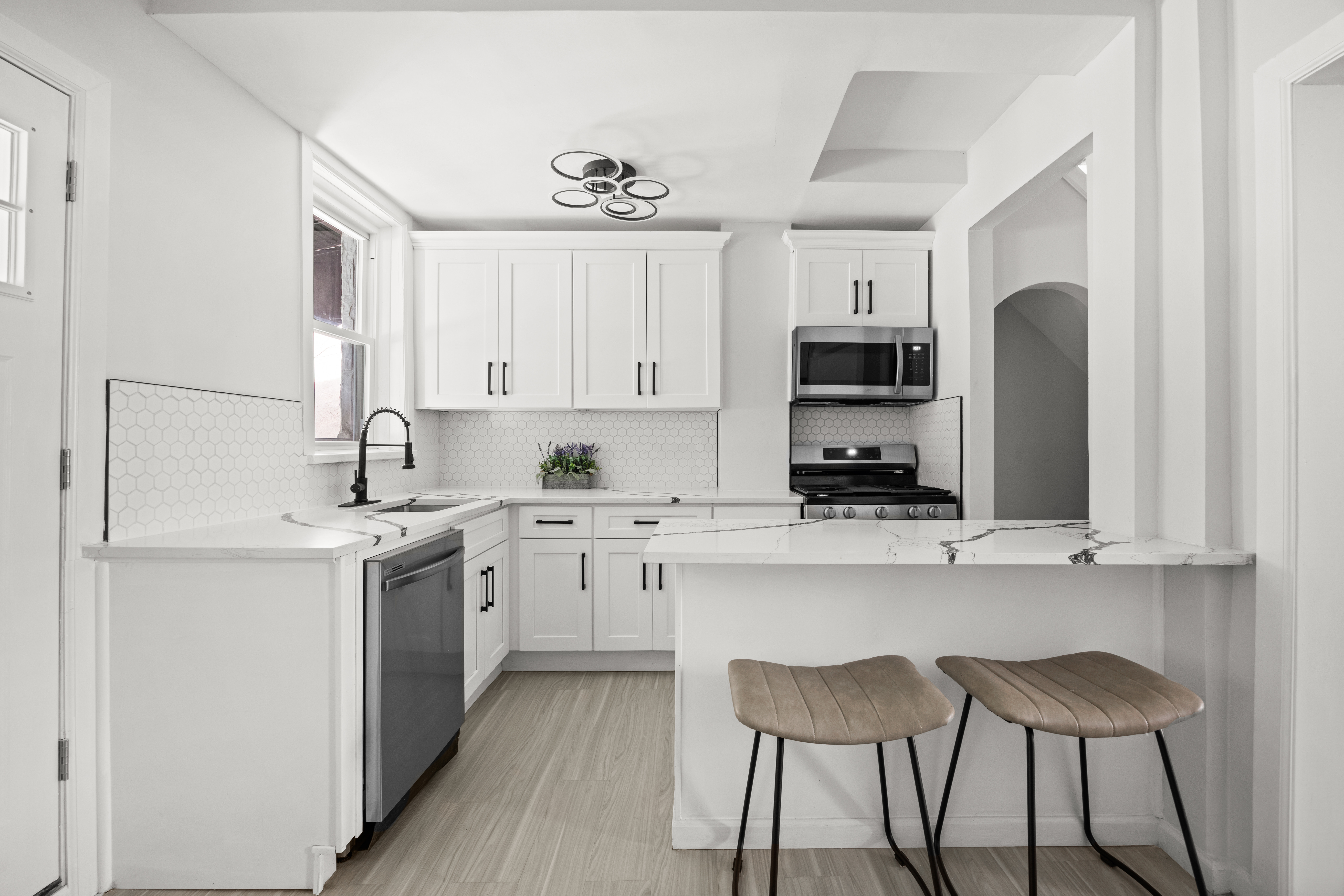 1588 Lincoln Place Brooklyn, NY 11233 - Photo 5 of 12 a kitchen with stainless steel appliances granite countertop a stove a sink and a refrigerator