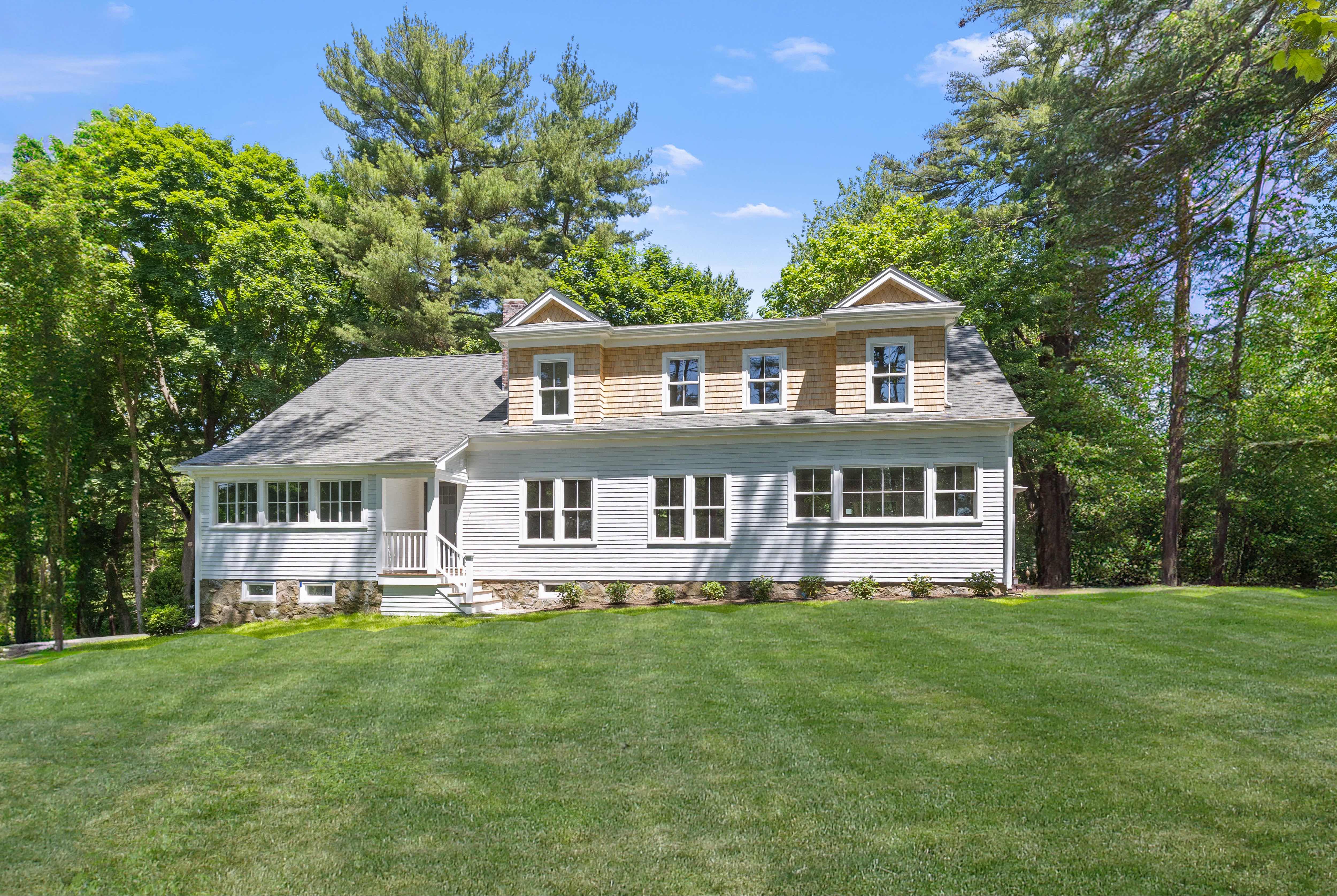 49 Garrison Road Hingham, MA 02043 - Photo 27 of 30 a front view of a house with a garden and trees