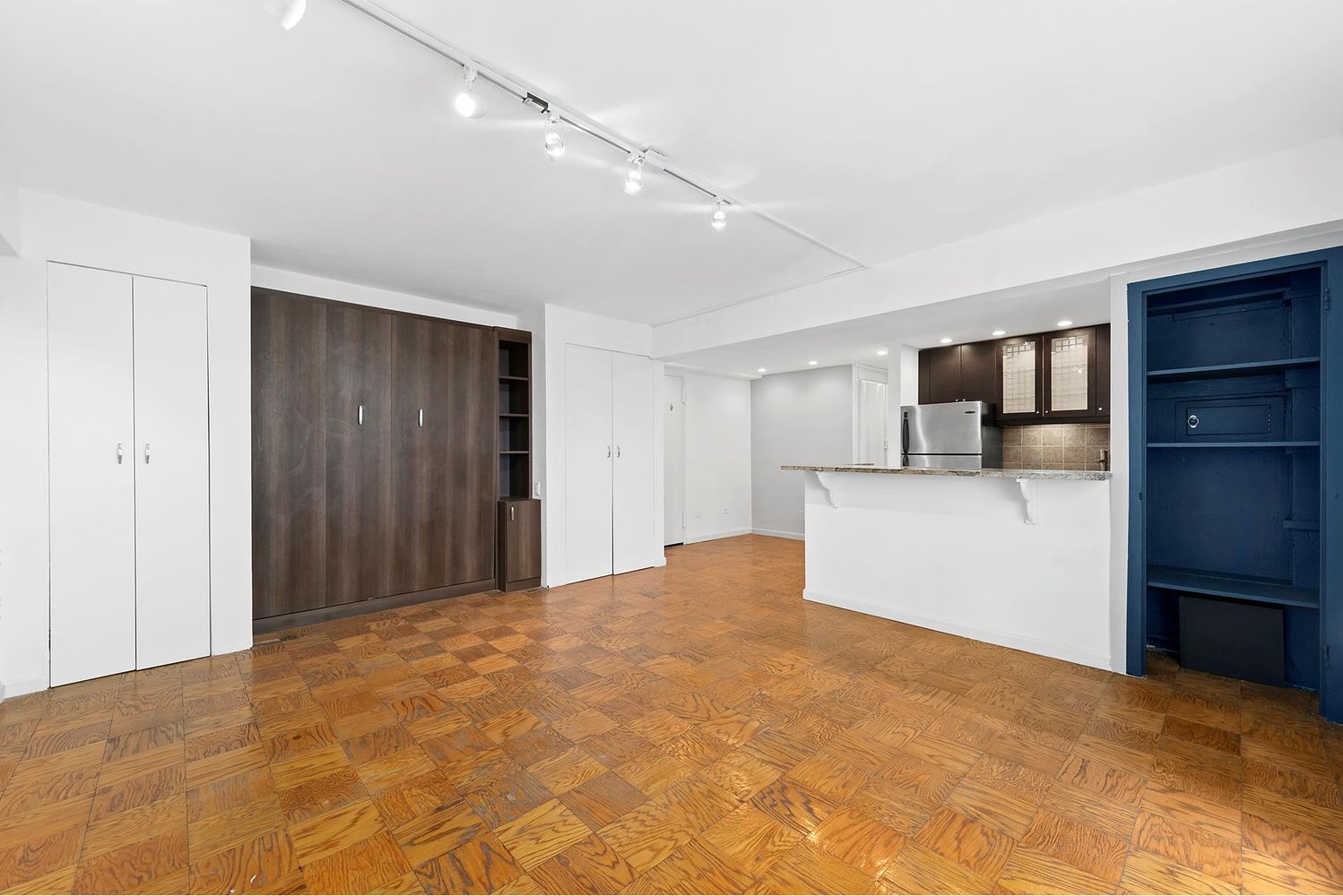 40 Sutton Place, Unit 8D Manhattan, NY 10022 - Photo 5 of 12 a view of a kitchen with a closet and a cabinet