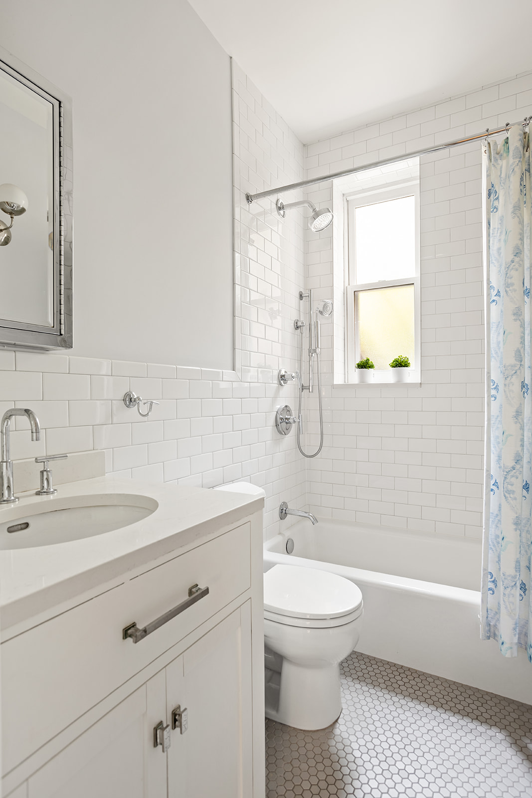 35-16 79th Street, Unit 1 Queens, NY 11372 - Photo 9 of 14 a bathroom with a sink a toilet and shower