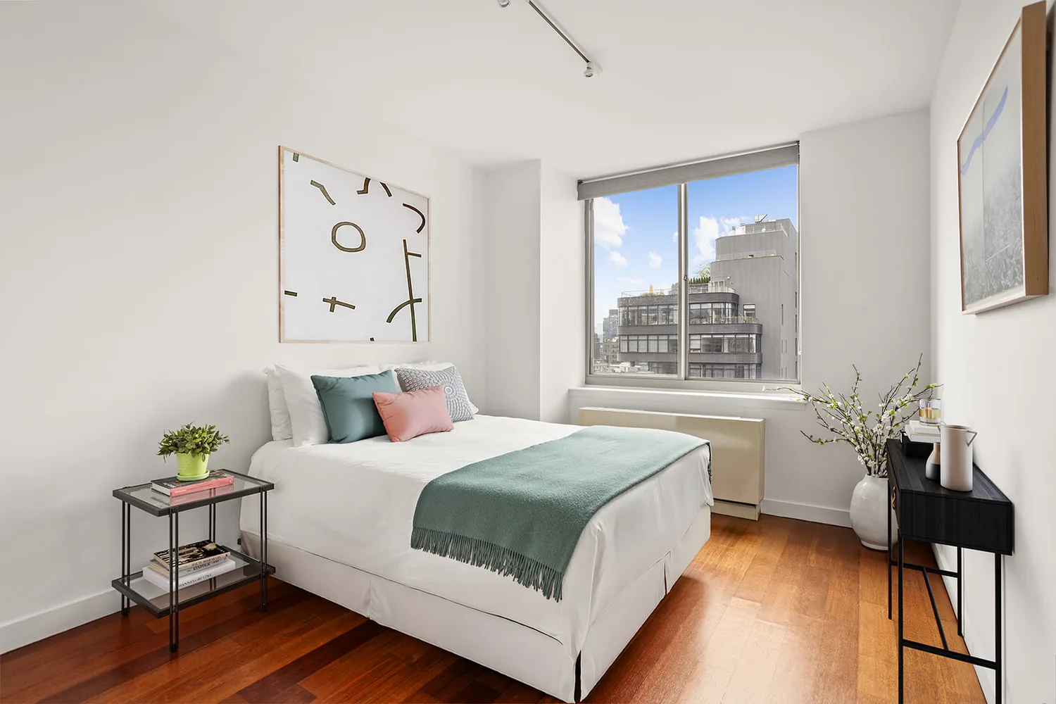 a bedroom with a bed and a table