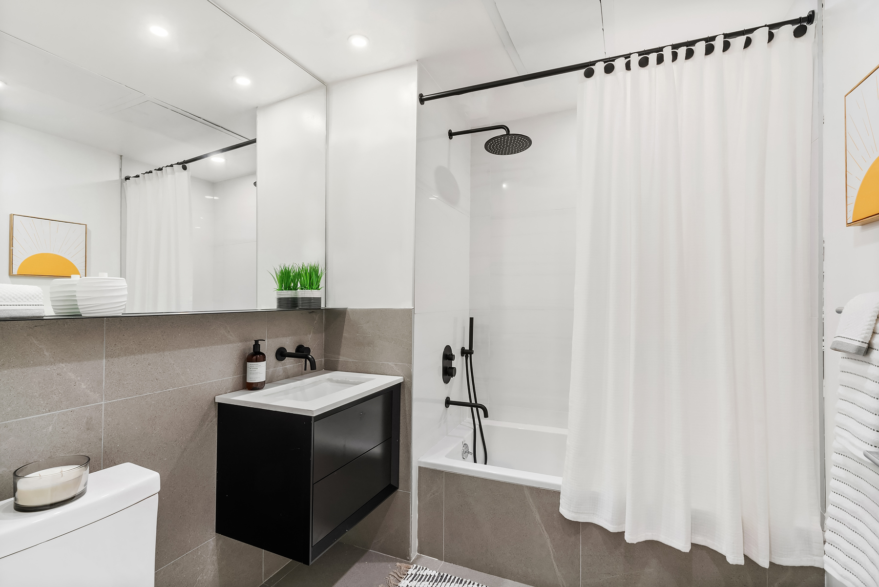 26 West 127th Street, Unit 4A Manhattan, NY 10027 - Photo 7 of 10 a bathroom with a sink a toilet and shower
