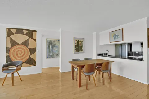 a kitchen with stainless steel appliances granite countertop a refrigerator and a stove