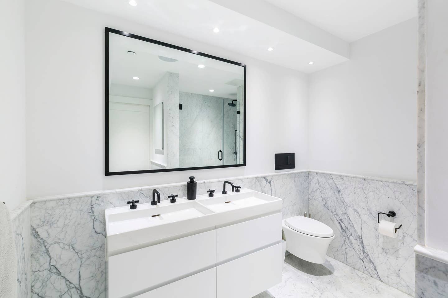 265 East Houston Street, Unit 4 Manhattan, NY 10002 - Photo 11 of 20 a bathroom with a sink and a mirror