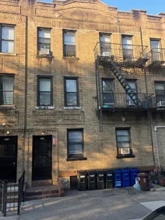 a front view of a building with multiple windows