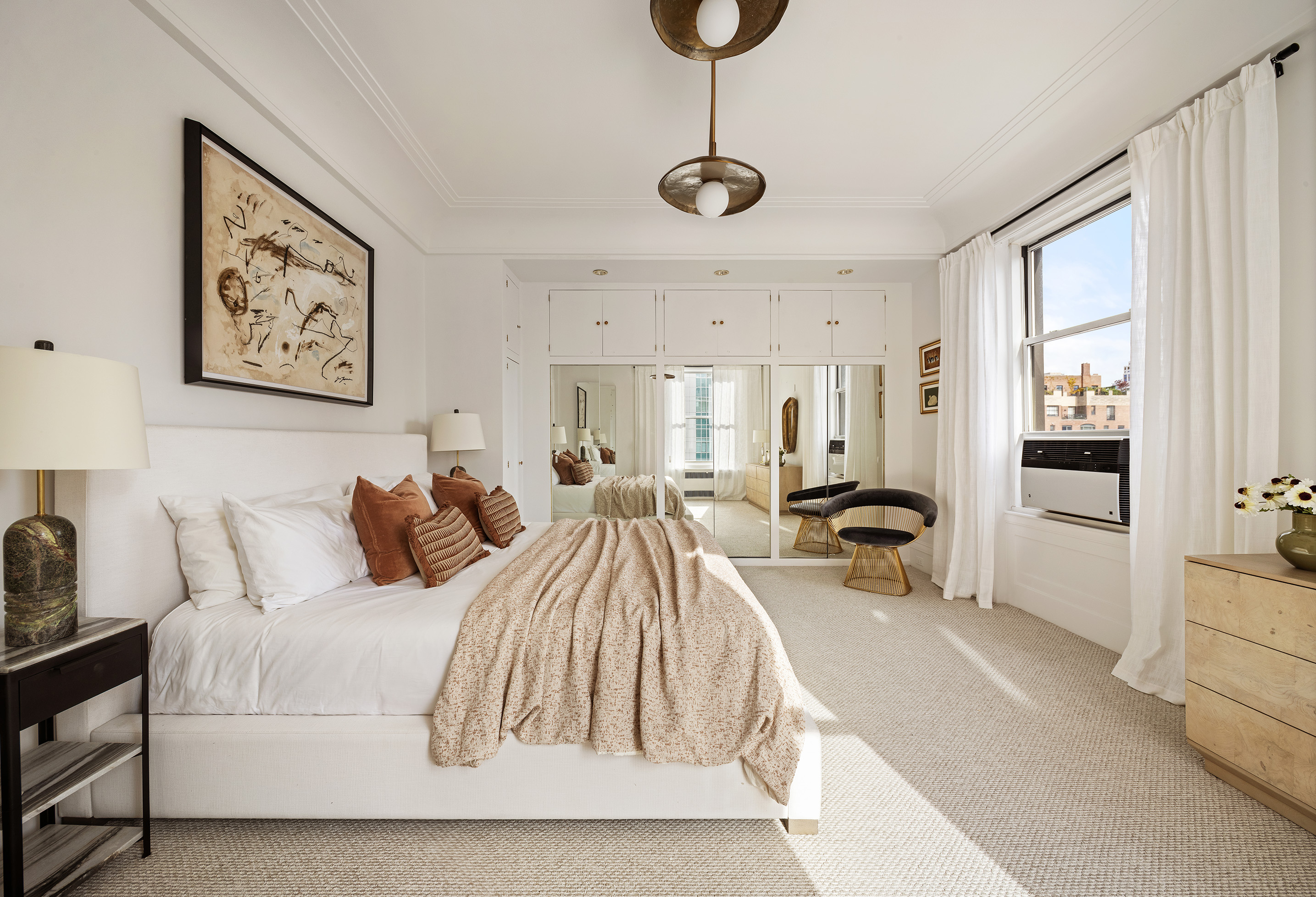 875 Park Avenue, Unit 11C Manhattan, NY 10075 - Photo 12 of 25 a spacious bedroom with a bed and glass windows