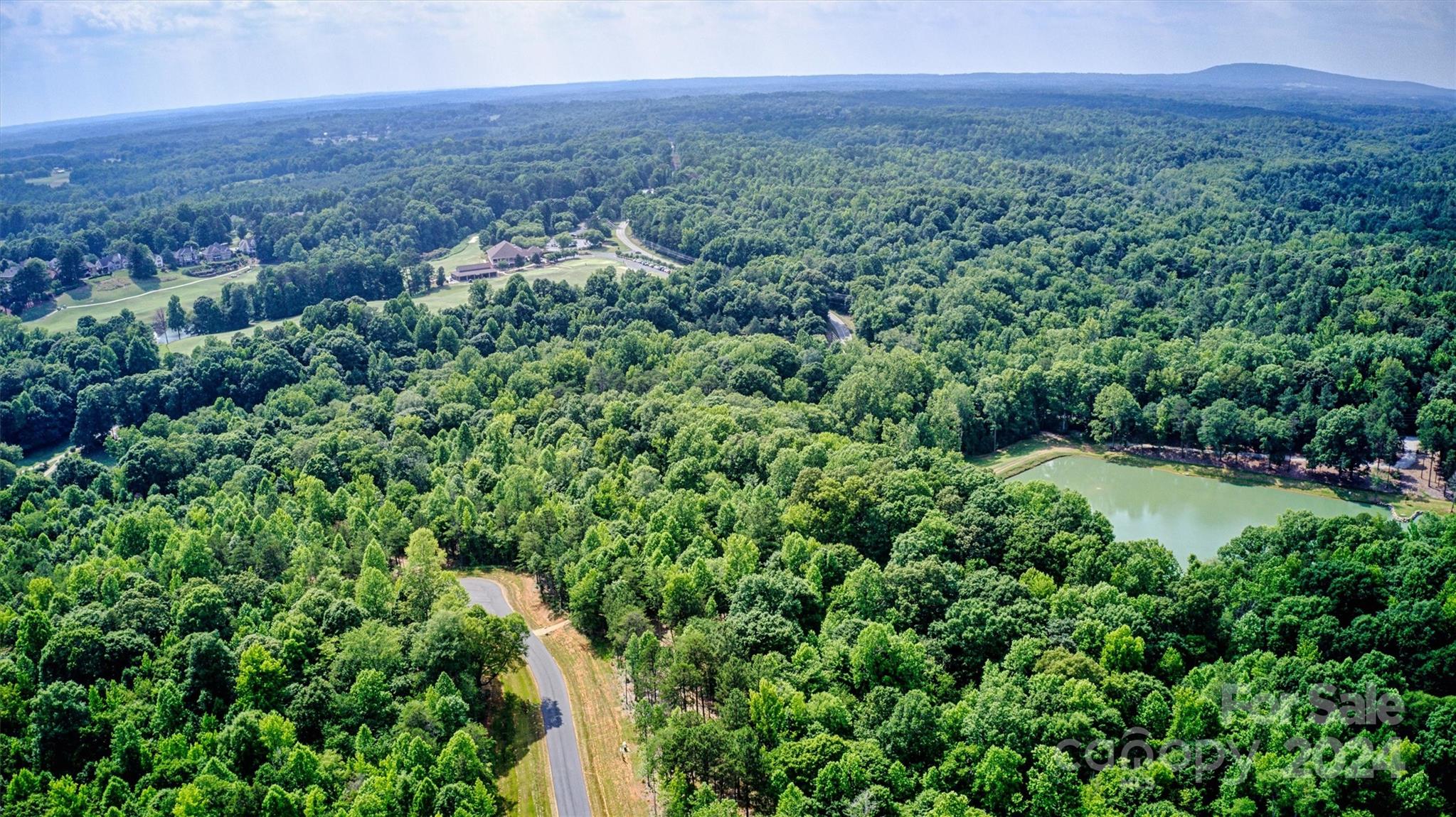 3 B Ventosa Drive Denver, NC 28037 - Photo 10 of 13 a view of a green field with lots of bushes