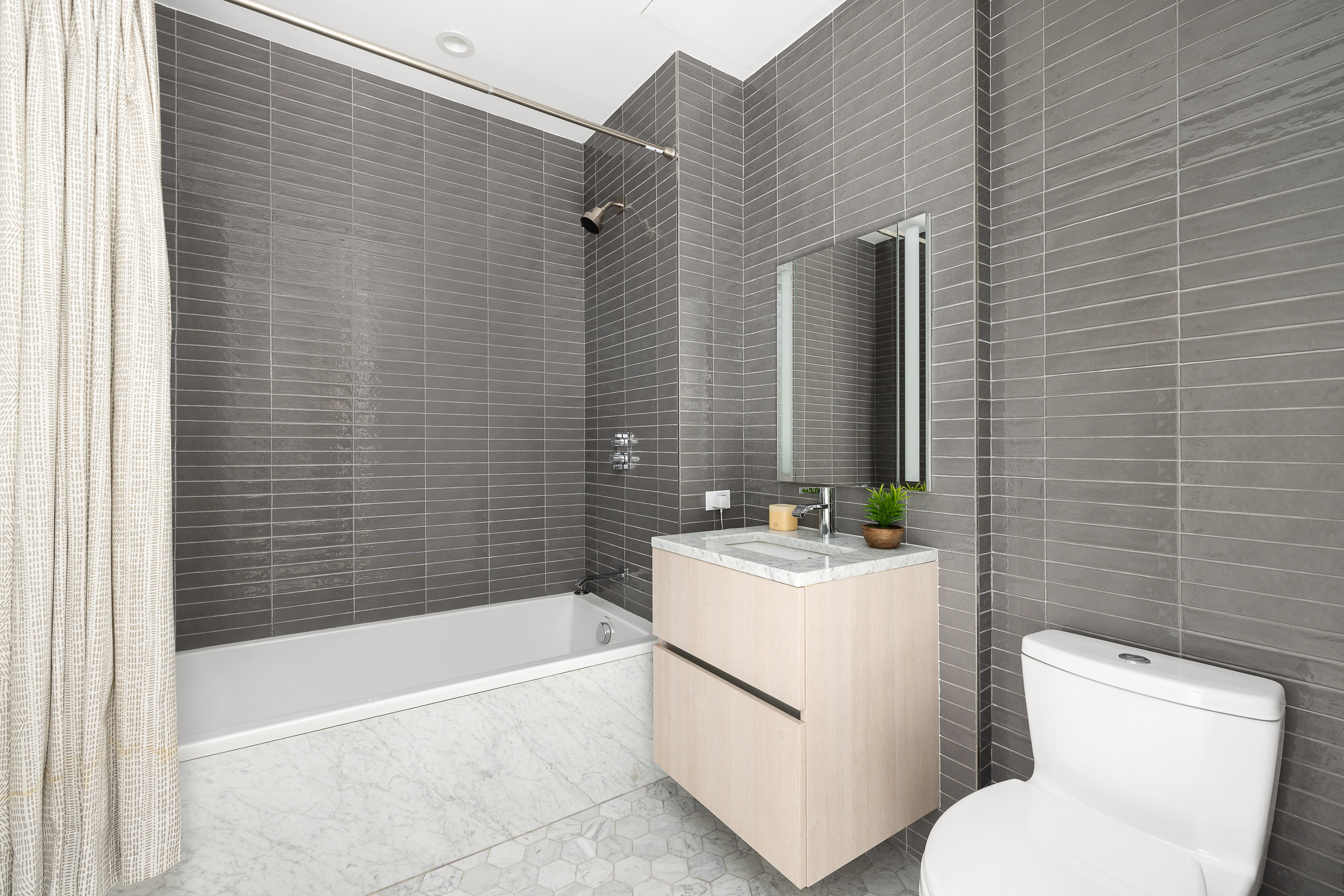 856 Washington Avenue, Unit 9A Brooklyn, NY 11238 - Photo 12 of 25 a bathroom with a sink toilet and shower