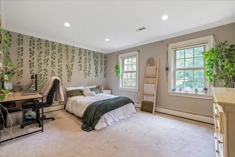 a living room with furniture window and wooden floor