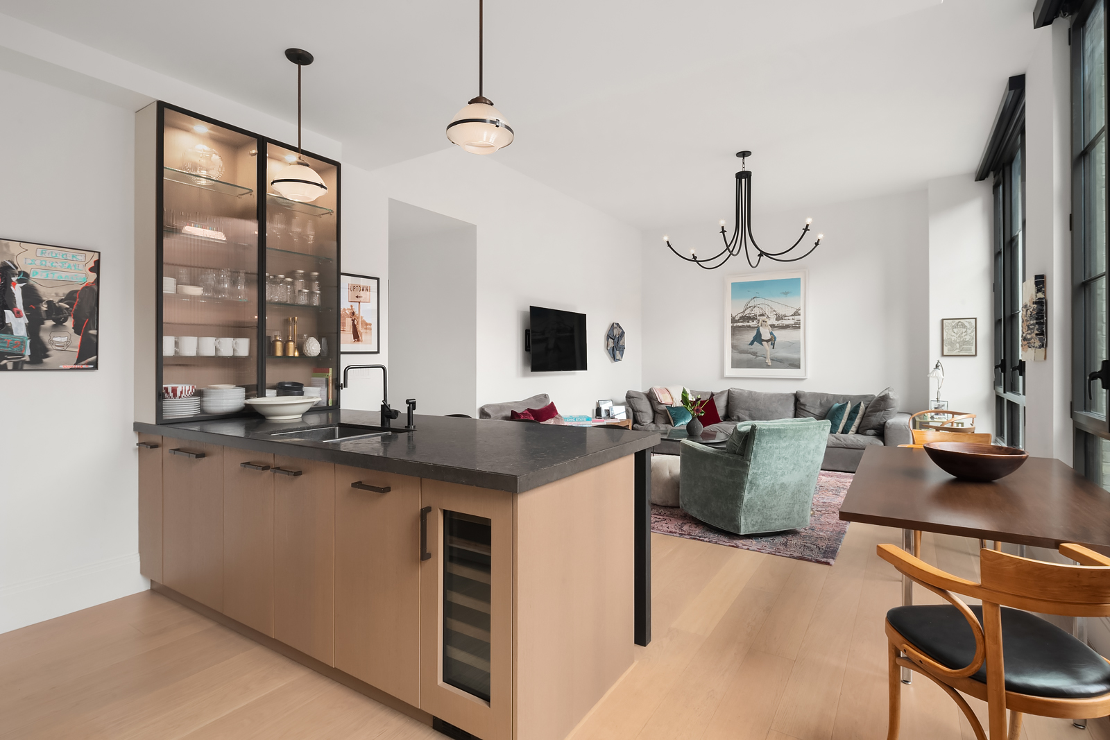 438 East 12th Street, Unit 6F Manhattan, NY 10009 - Photo 2 of 27 a view of kitchen with kitchen island stainless steel appliances sink stove microwave and living room view