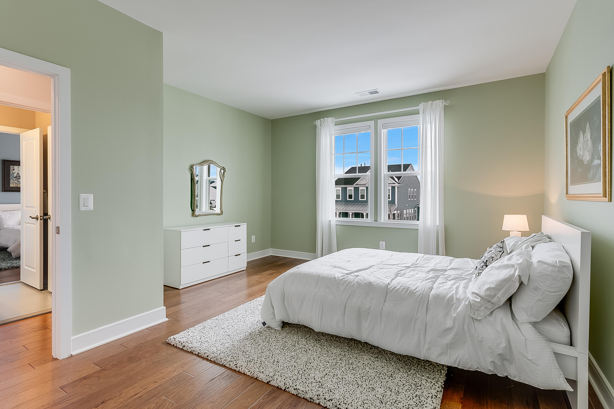 1011 Justinian Street Leesburg, VA 20175 - Photo 34 of 56 a bedroom with a bed and wooden floor