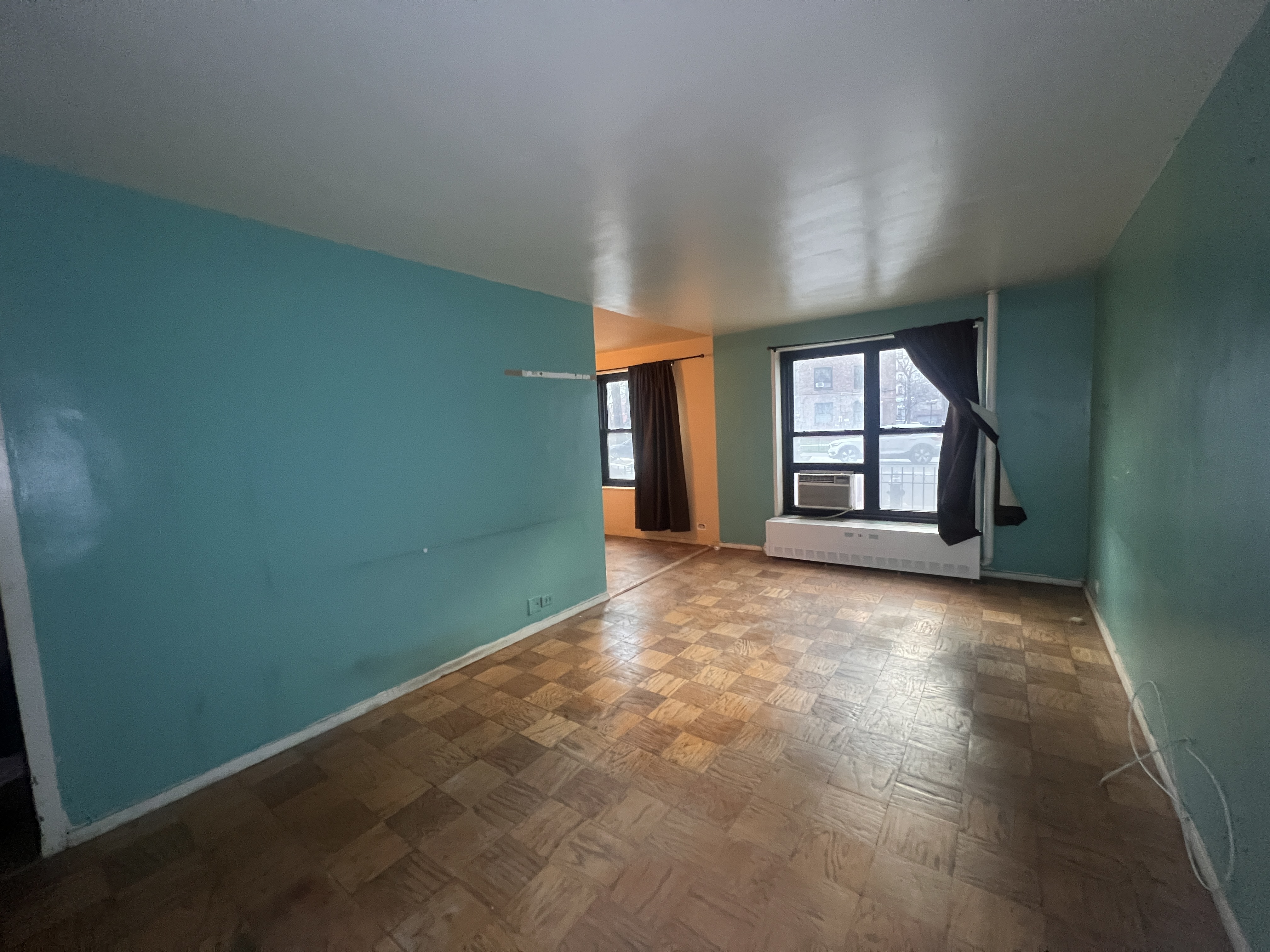 201 Clinton Avenue, Unit 1G Brooklyn, NY 11205 - Photo 2 of 8 an empty room with windows and closet
