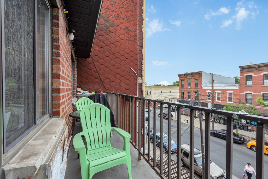 20-70 Steinway Street Queens, NY 11105 - Photo 6 of 8 a balcony with an outdoor space