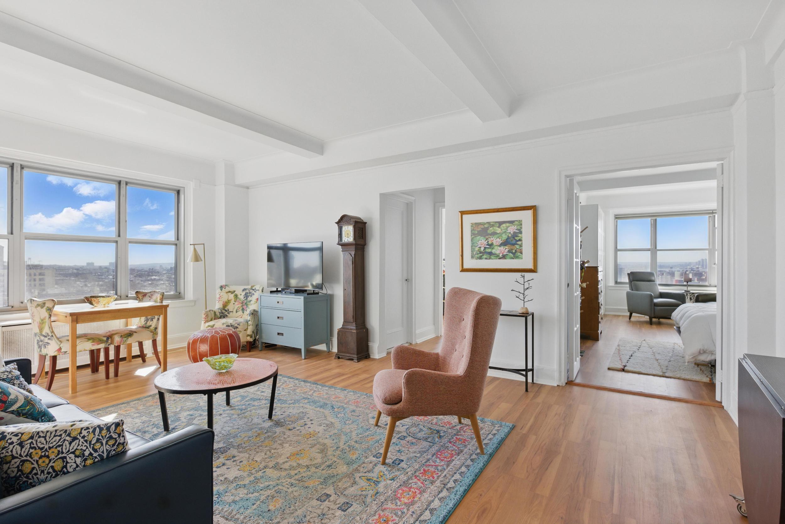 1 Plaza Street West, Unit 12C Brooklyn, NY 11217 - Photo 2 of 13 a living room with furniture and a table