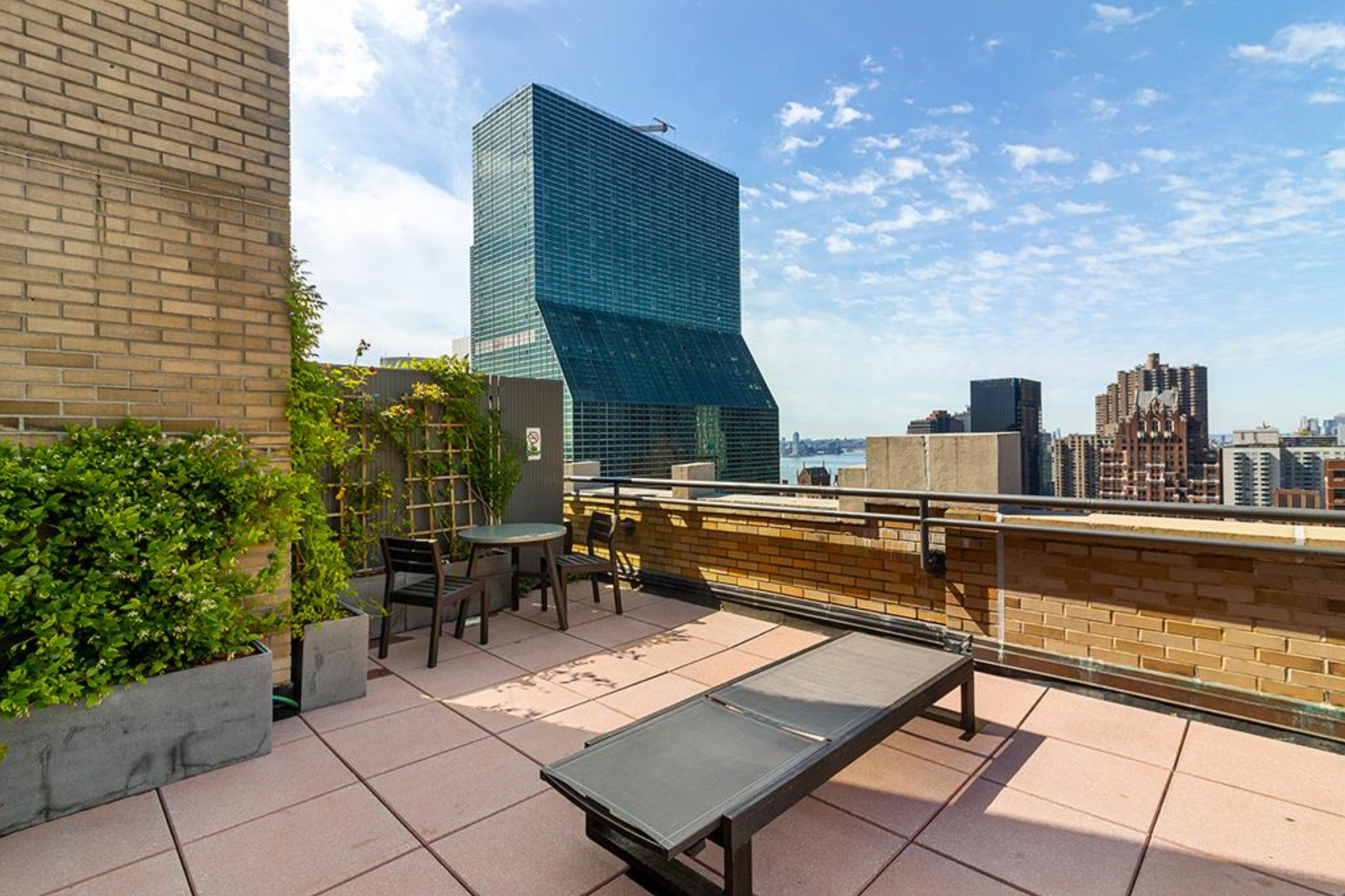 310 East 46th Street, Unit 19F Manhattan, NY 10017 - Photo 16 of 17 a view of a terrace with chairs