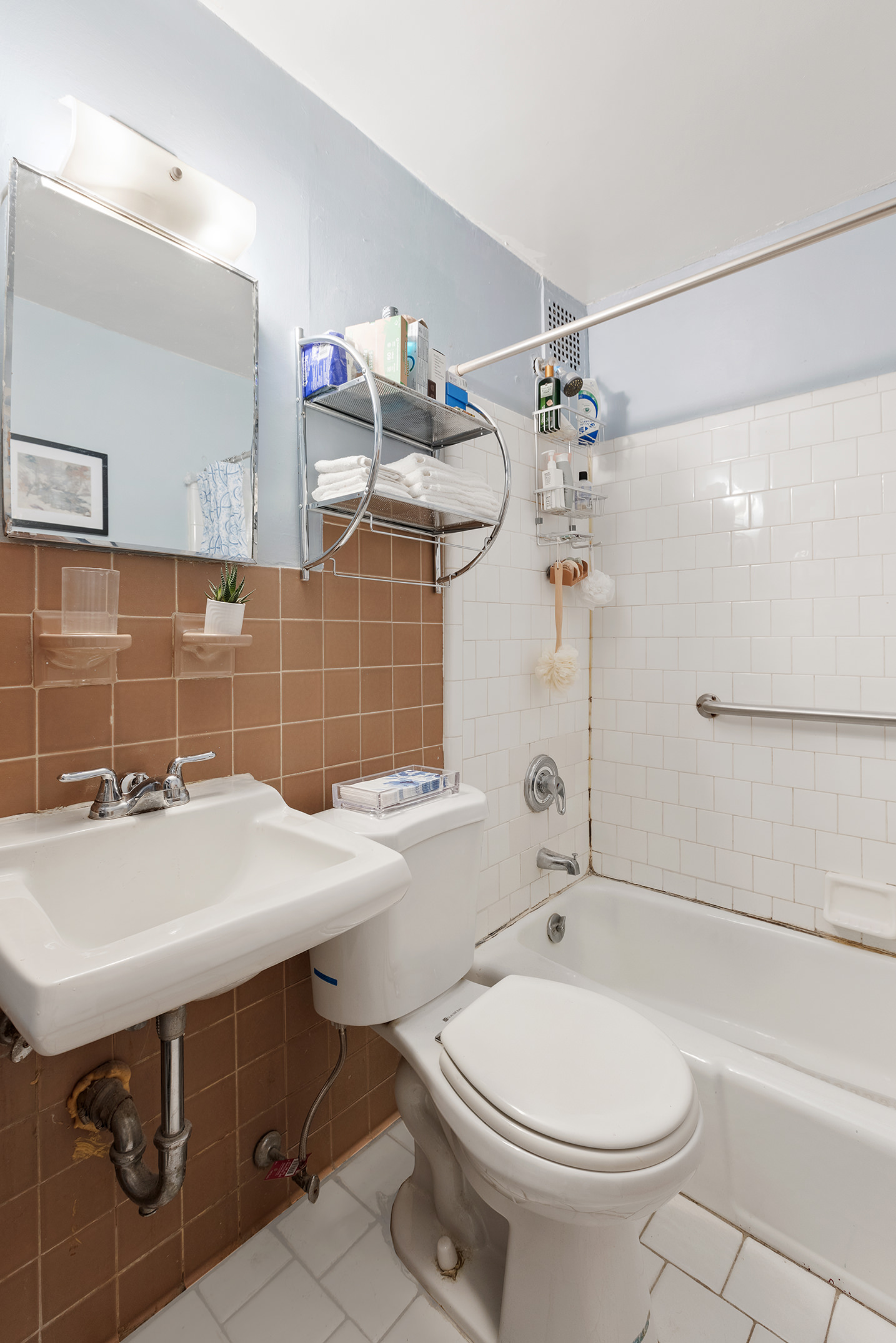 138 West 73rd Street Manhattan, NY 10023 - Photo 29 of 35 a bathroom with a sink a toilet and shower