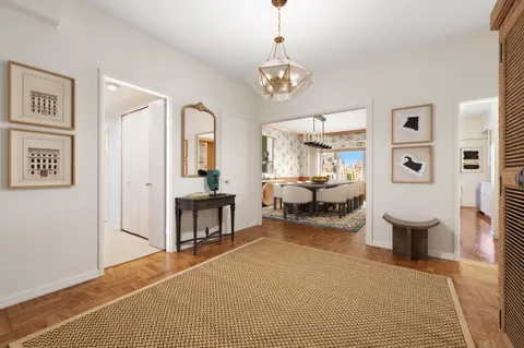 a bedroom with furniture and a wooden floor