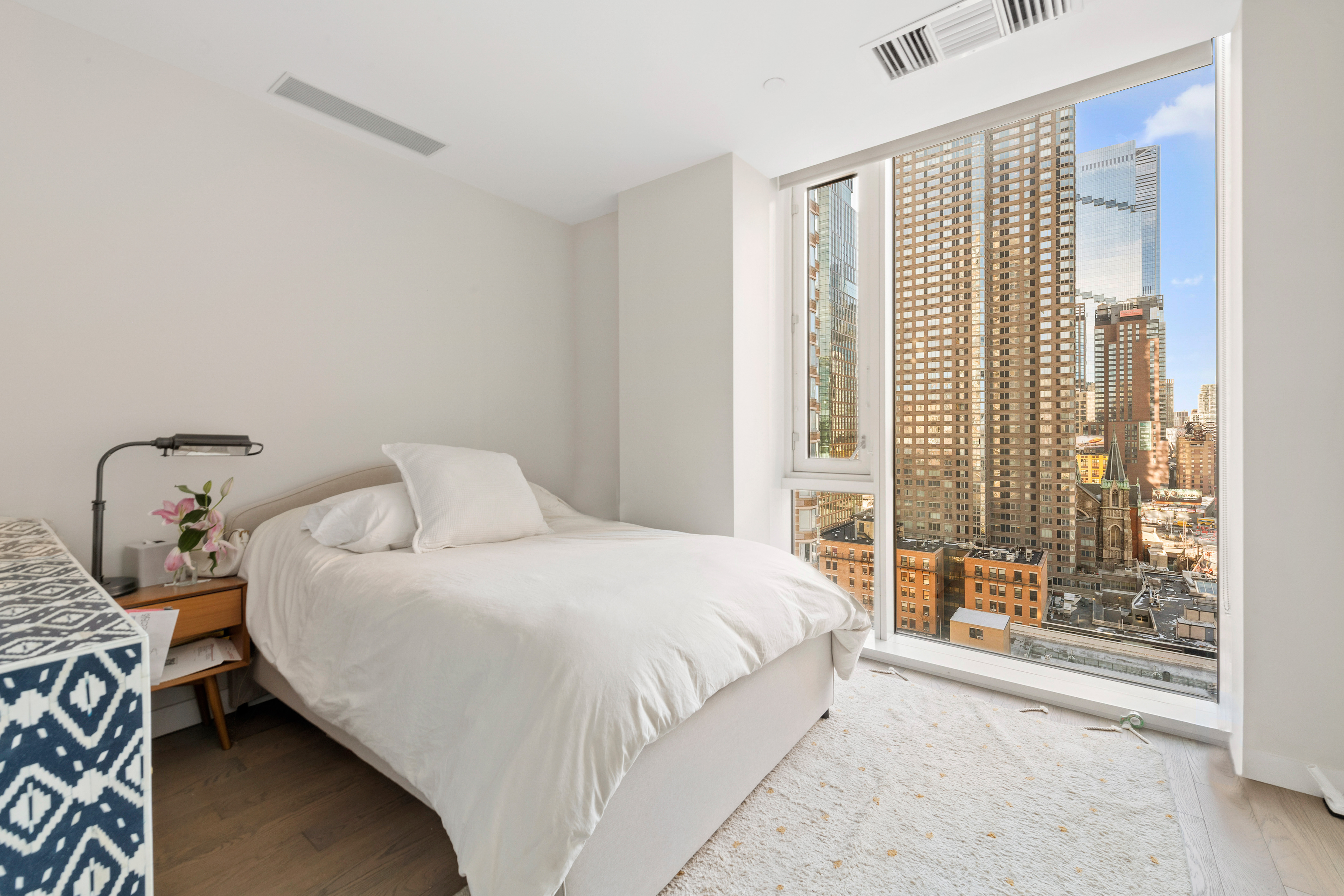 505-513 West 43rd Street, Unit PHG Manhattan, NY 10036 - Photo 9 of 20 a bedroom with a bed and a window
