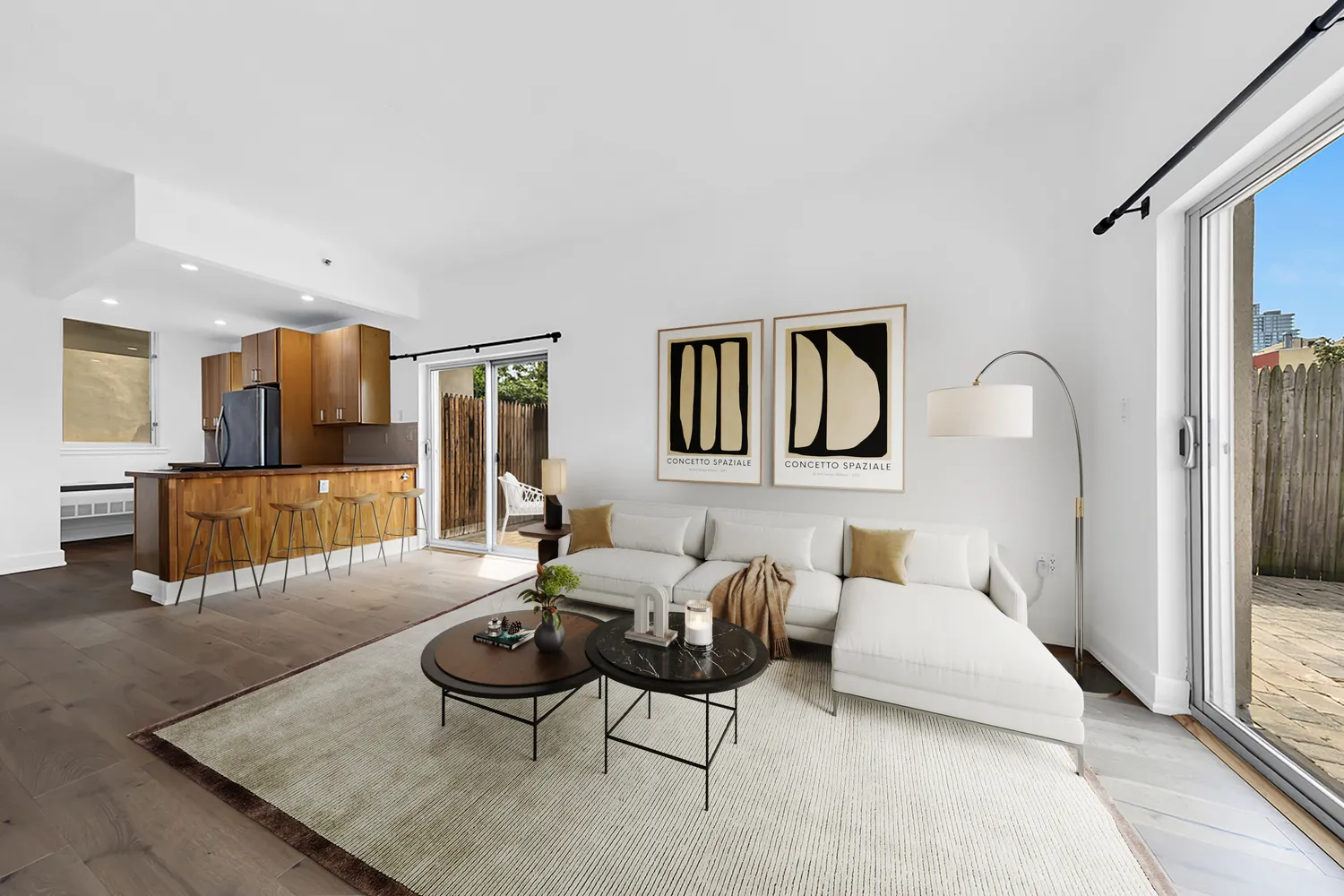 a living room with furniture a rug and a large mirror