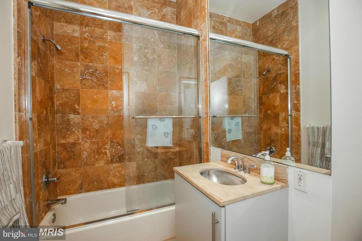 1300 13th Street Northwest, Unit 905 Washington, DC 20005 - Photo 13 of 18 a bathroom with a sink and a bathtub