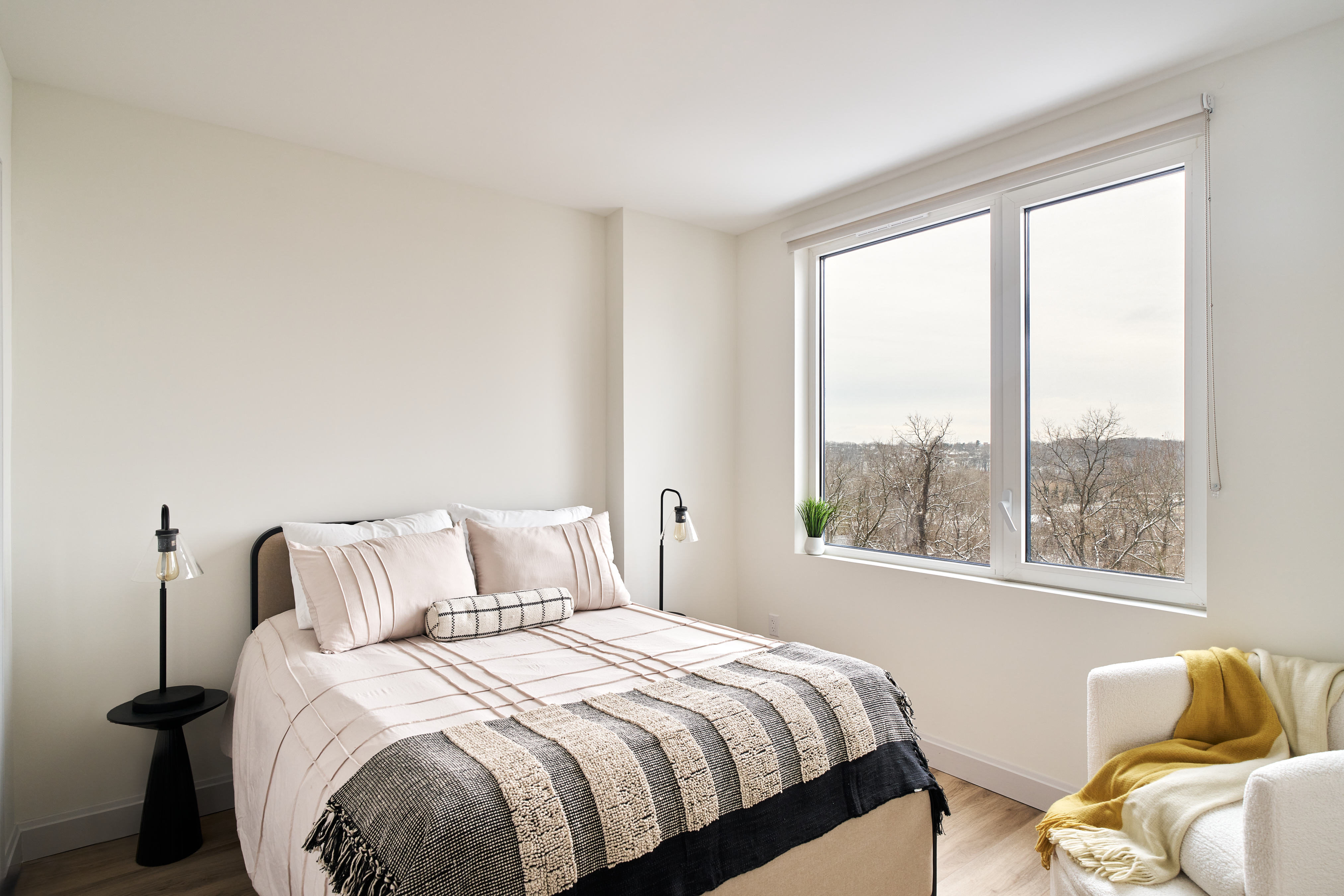 44-14 Douglaston Parkway, Unit 3B Queens, NY 11363 - Photo 5 of 12 a bedroom with bed and a window