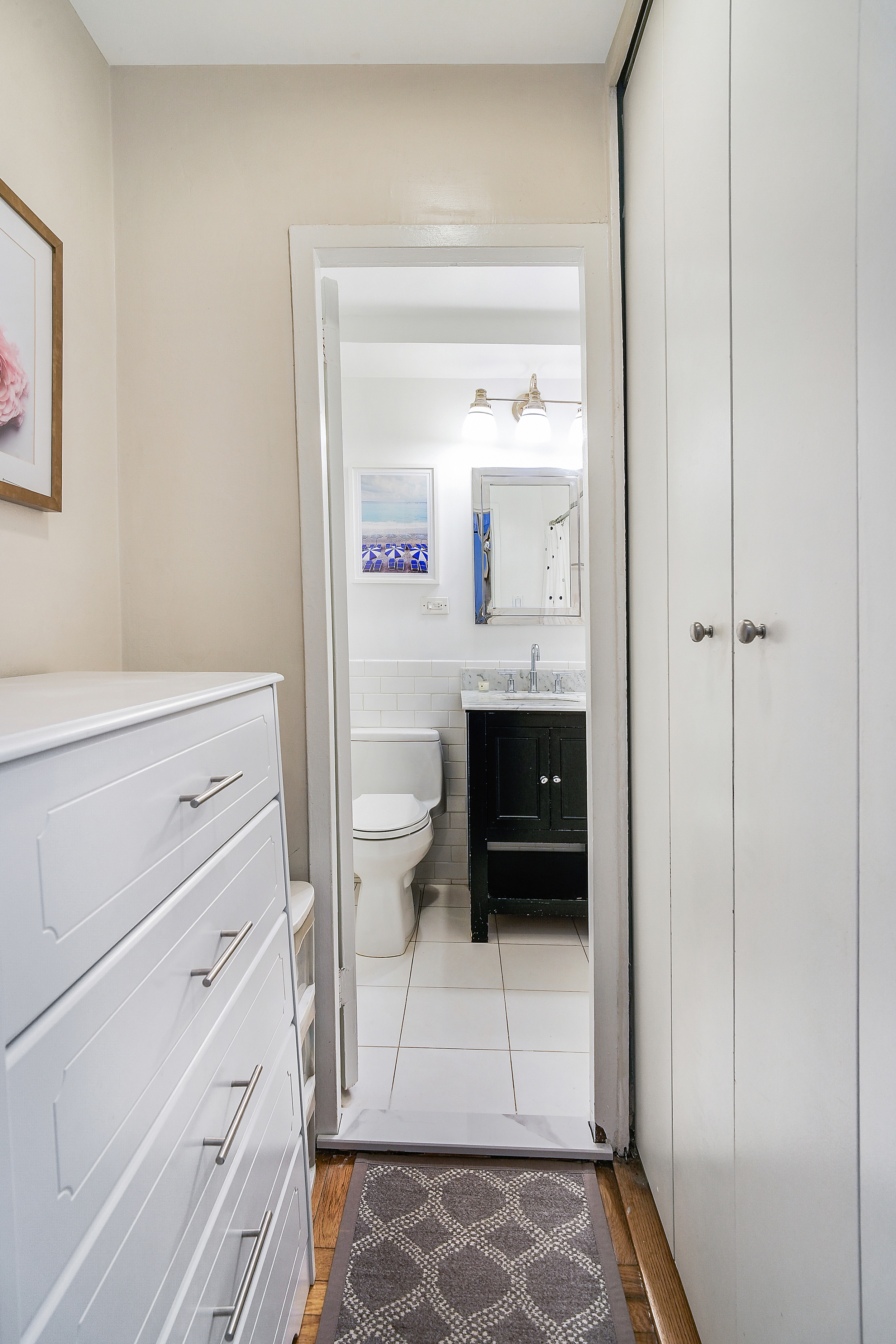 241 East 76th Street, Unit 2G Manhattan, NY 10021 - Photo 6 of 11 a bathroom with a toilet and a sink