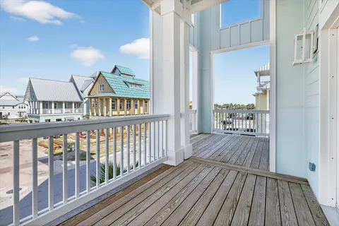 a view of a balcony with wooden floor