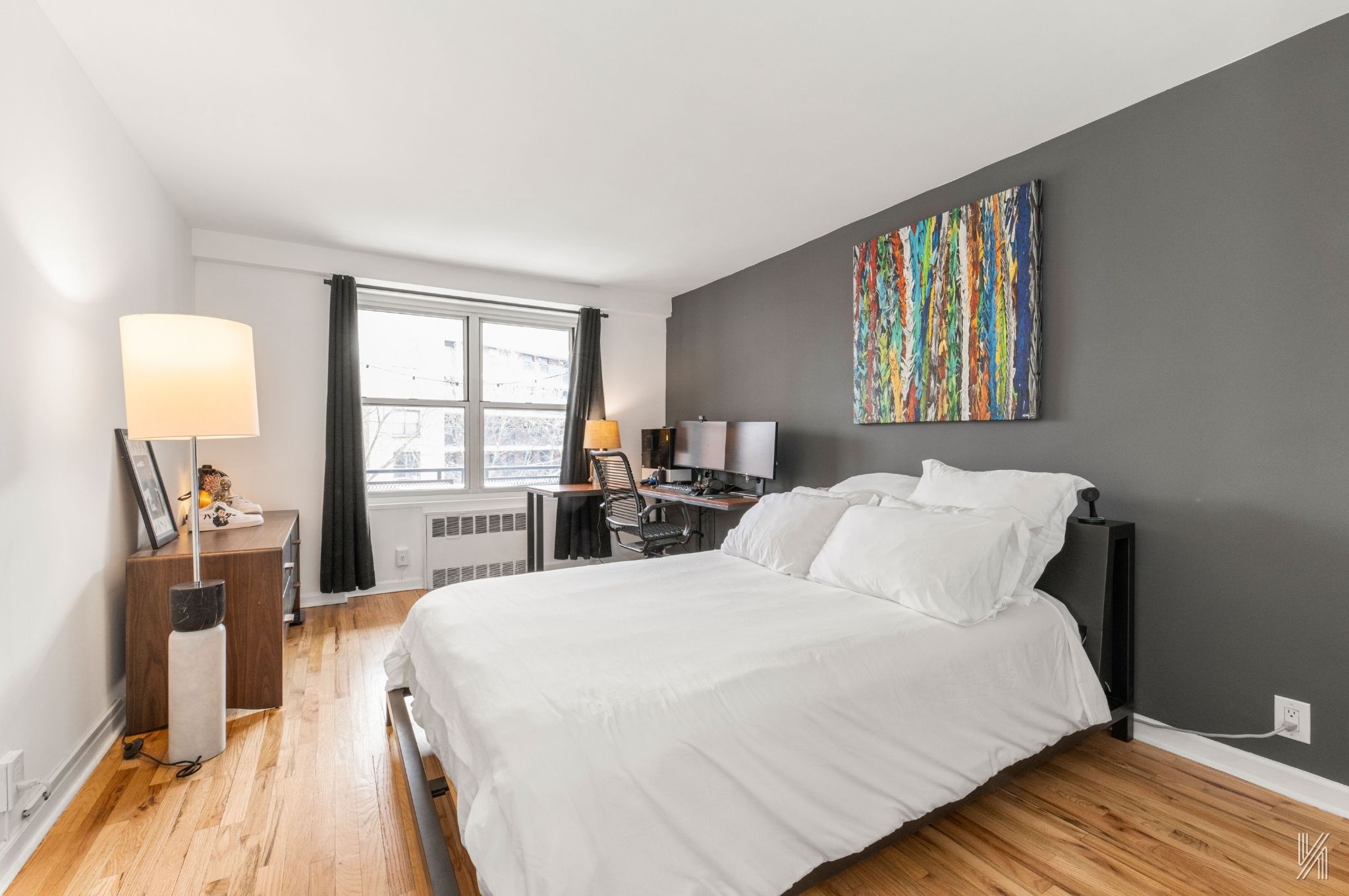 35-50 85th Street, Unit 7H Queens, NY 11372 - Photo 9 of 16 a bed room with a bed and a window