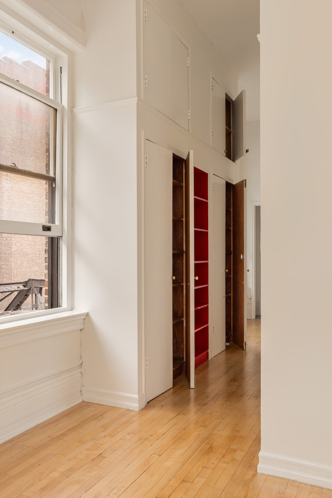 874 Broadway, Unit 907 Manhattan, NY 10003 - Photo 12 of 22 a view of an empty room with a fireplace