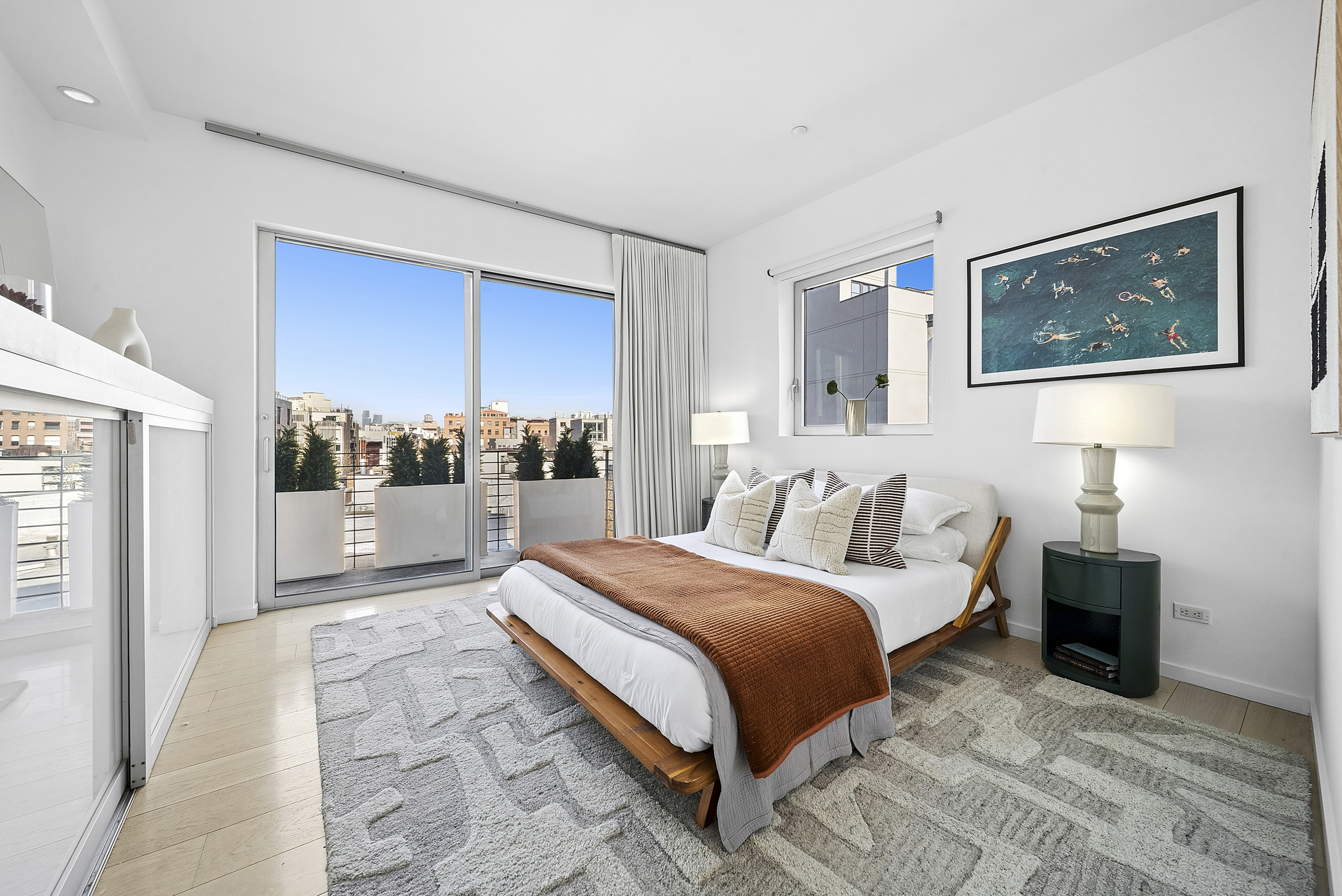265 Wythe Avenue, Unit 4 Brooklyn, NY 11249 - Photo 13 of 18 a bedroom with a bed and a view of kitchen