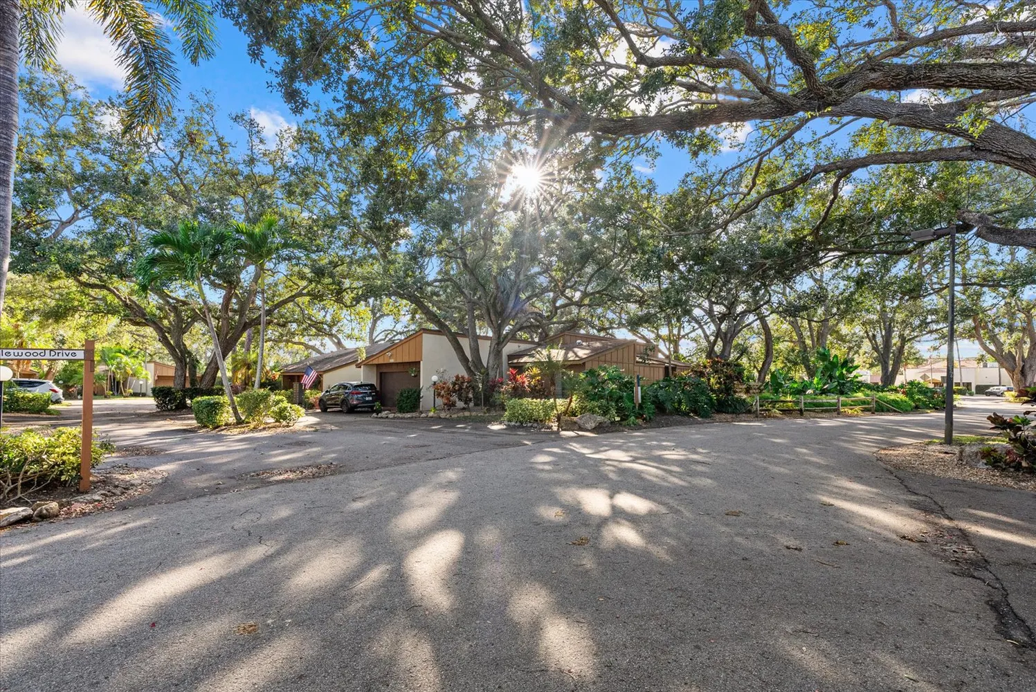 a view of a patio with a dining table and chairs with a fire pit