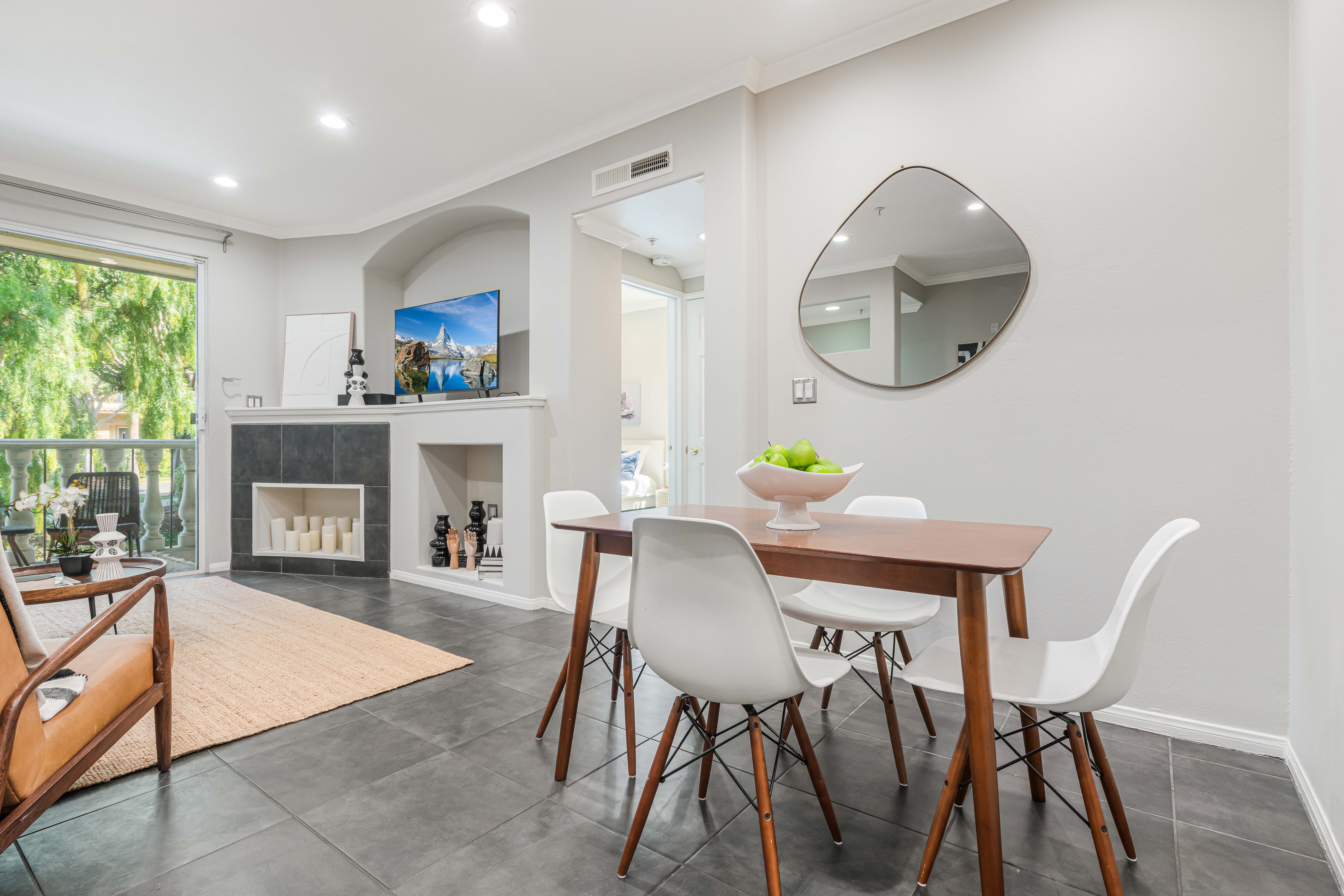 12963 West Runway Road Playa Vista, CA 90094 - Photo 3 of 39 a living room with furniture a fireplace and a large window