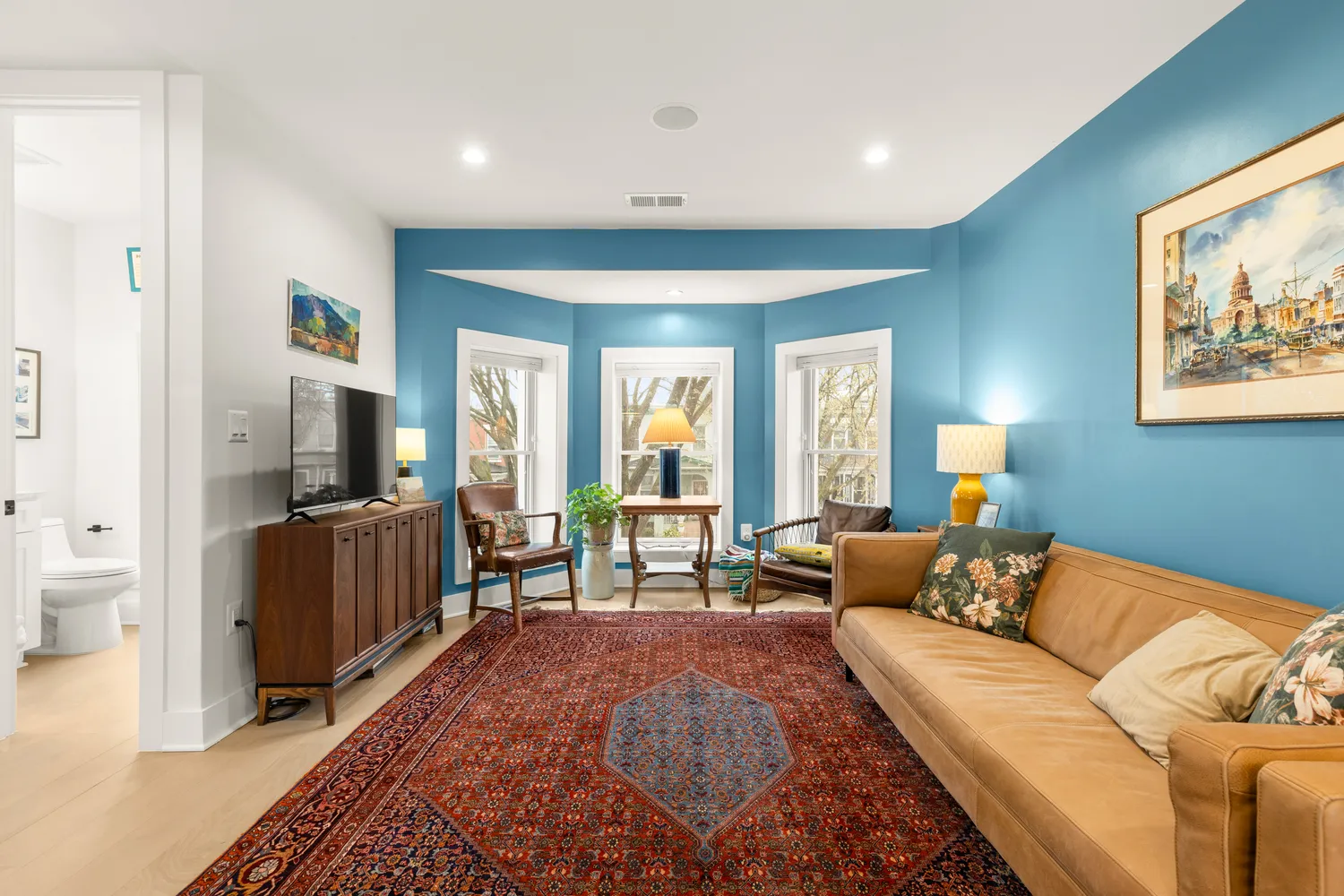 a living room with furniture and a flat screen tv