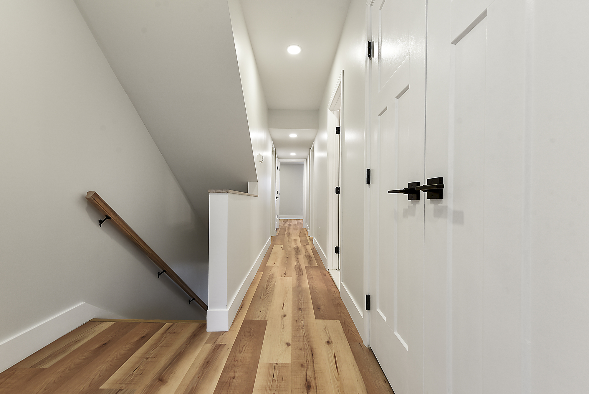 5412 Carnegie Street Pittsburgh, PA 15201 - Photo 29 of 55 a view of a hallway with wooden floor and staircase