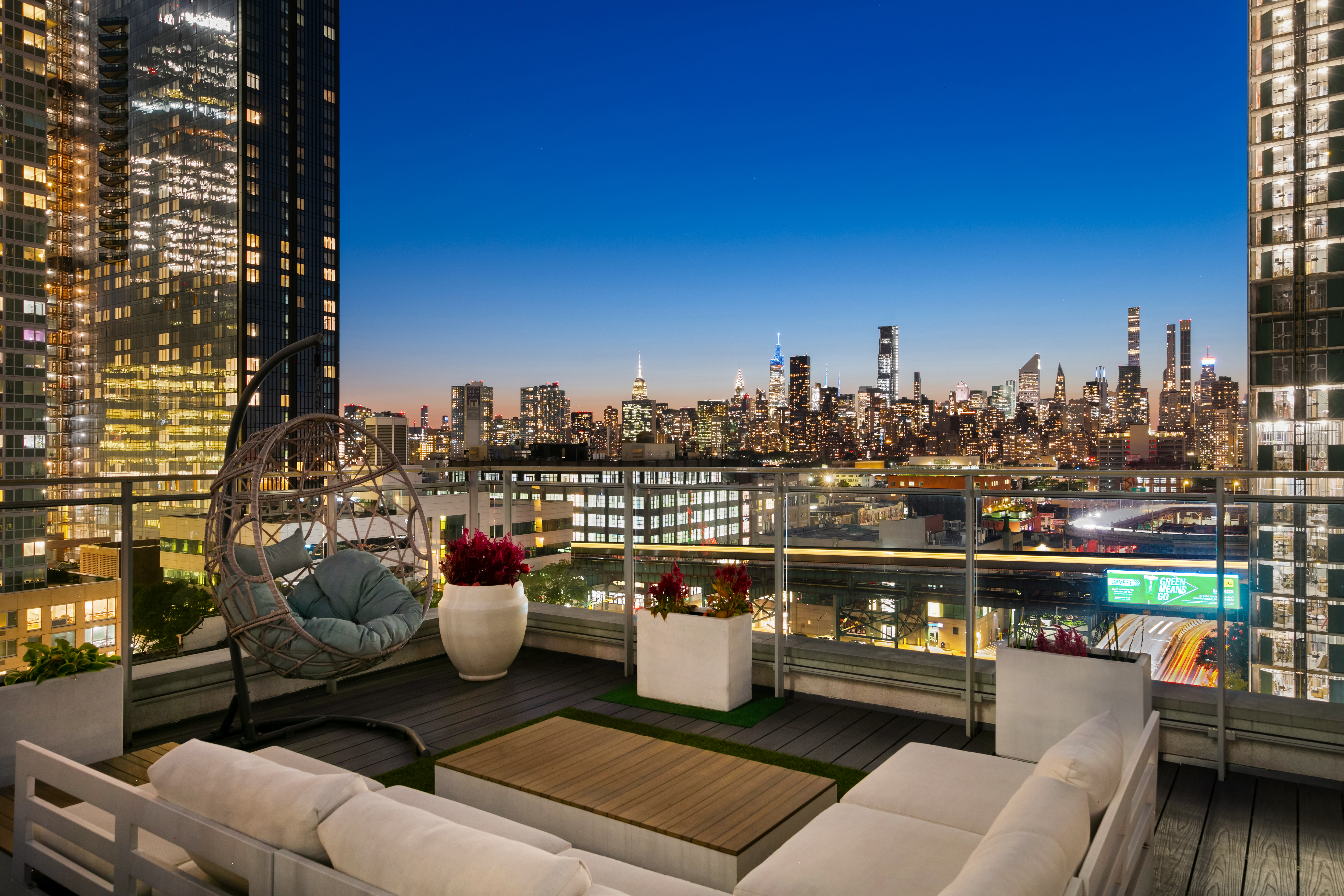 42-44 Crescent Street, Unit PHB Queens, NY 11101 - Photo 10 of 11 a view of a balcony with city view
