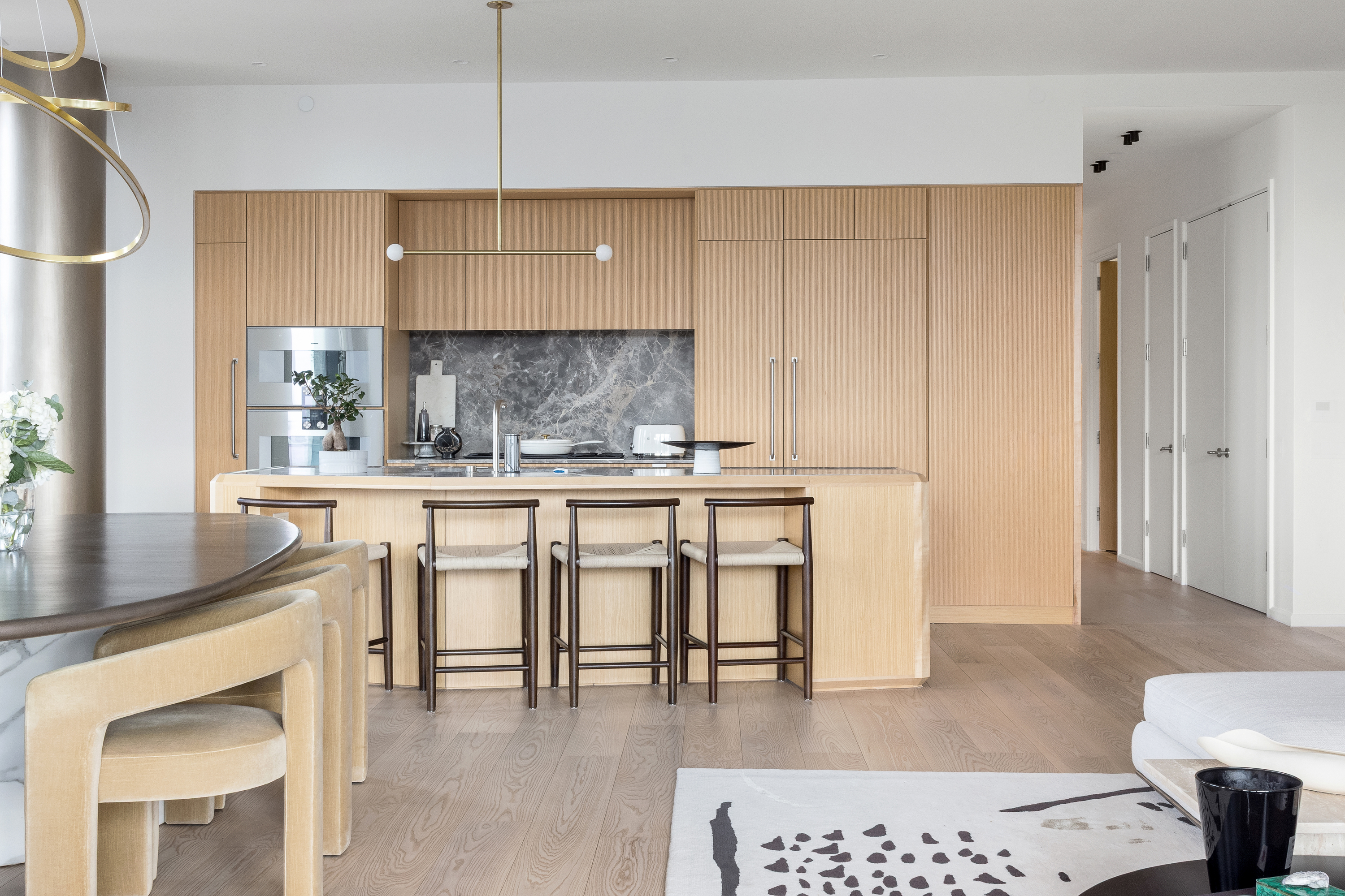 30 Front Street, Unit 19A Brooklyn, NY 11201 - Photo 13 of 25 a kitchen with kitchen island granite countertop a sink cabinets and stainless steel appliances
