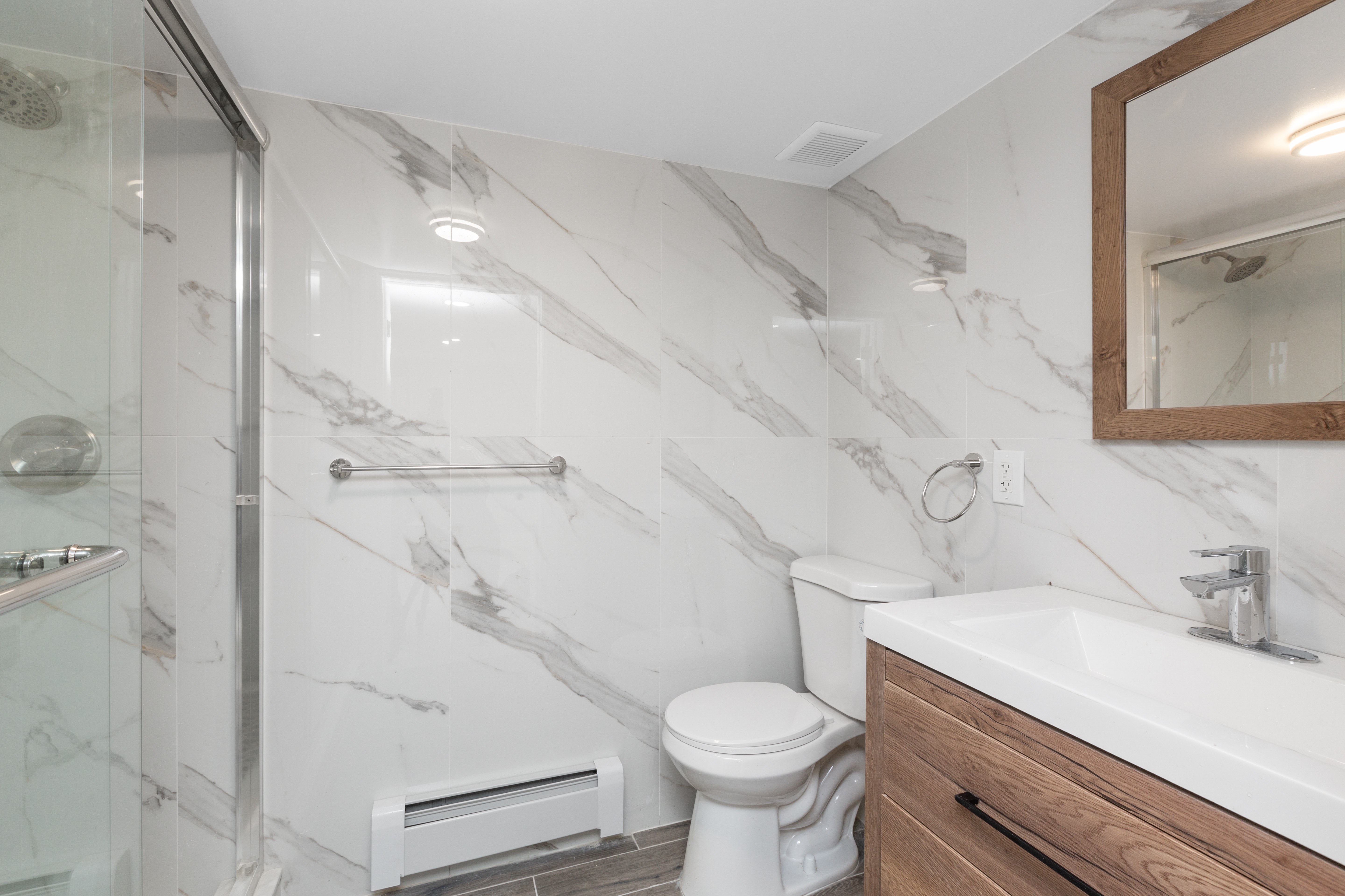 143-10 Shore Avenue Queens, NY 11435 - Photo 24 of 30 a bathroom with a sink a toilet and shower